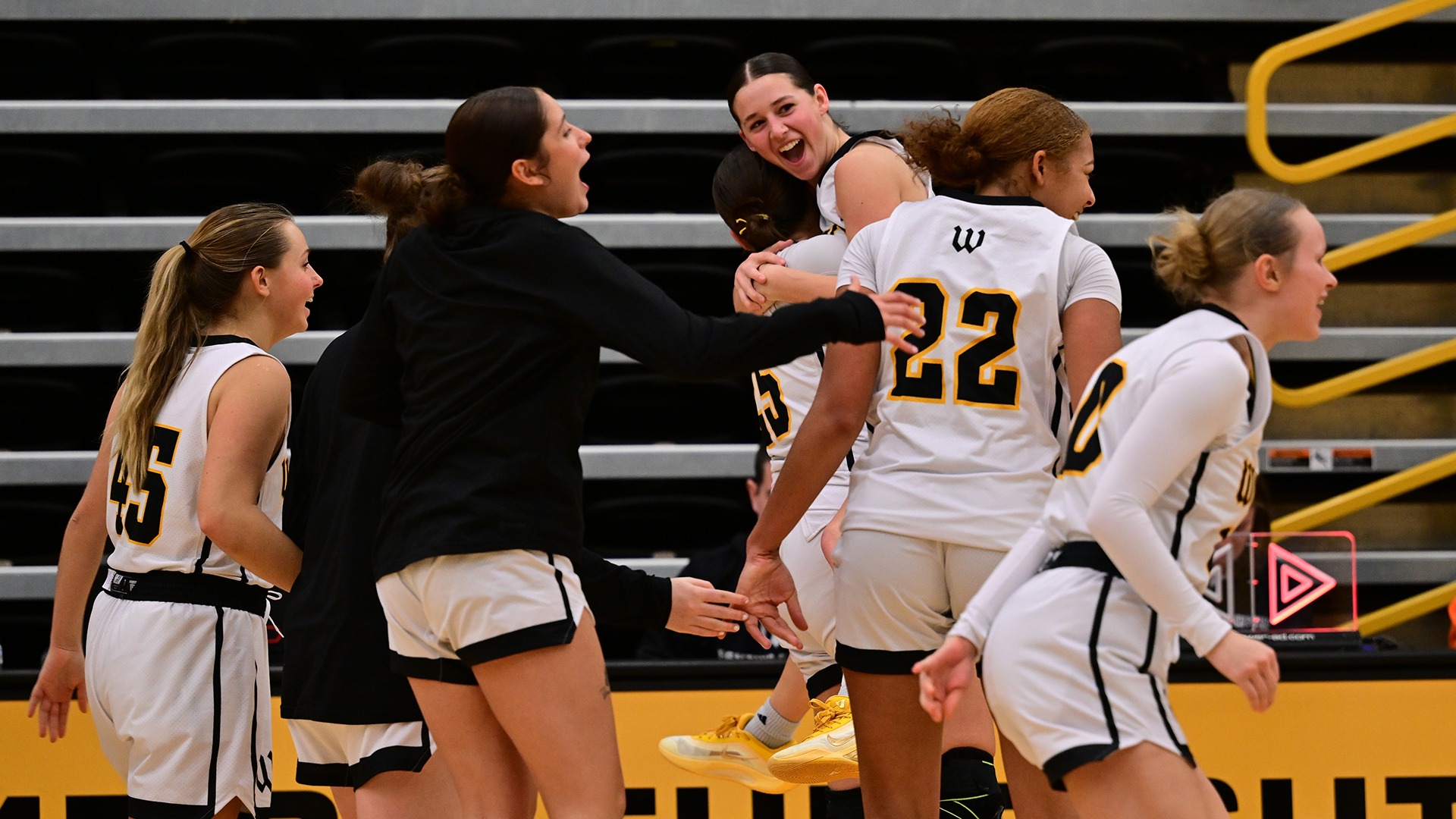 Wooster women's basketball celebrates a win over Wittenberg in 2026
