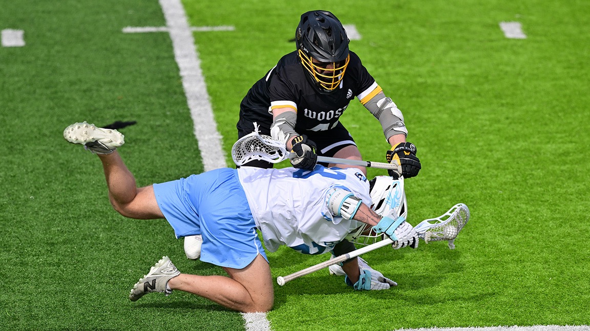 Allen Ginder pushes down an Elmhurst opponent 