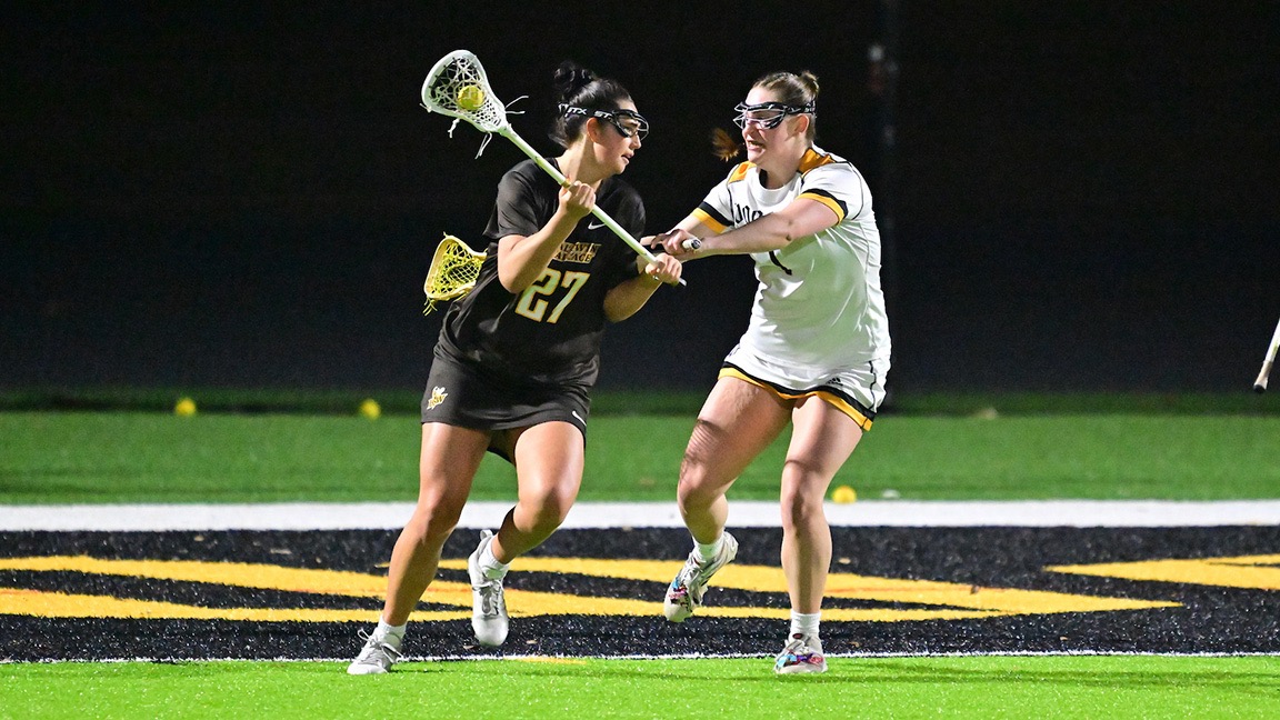 Anna Mapes plays defense against an opponent