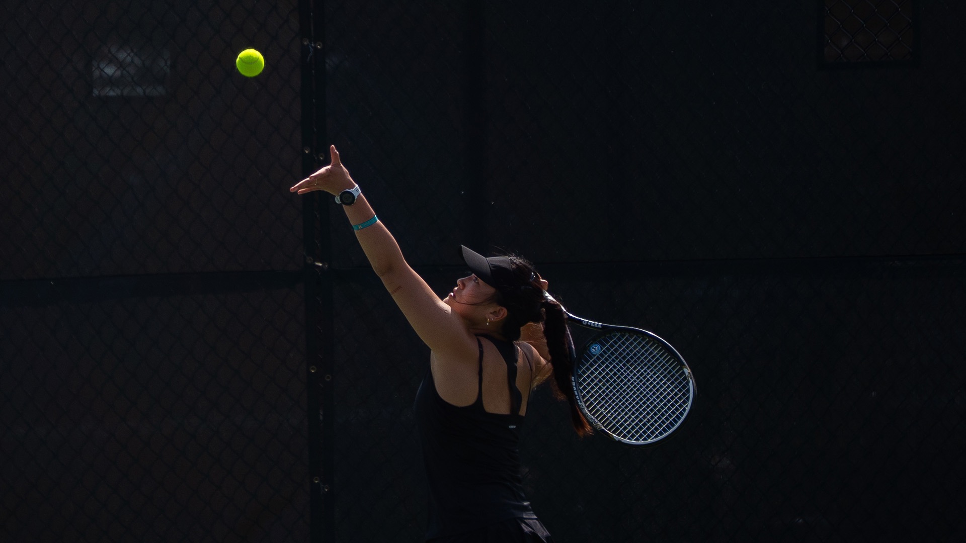 Willow Hernishin lobs a ball up for a serve