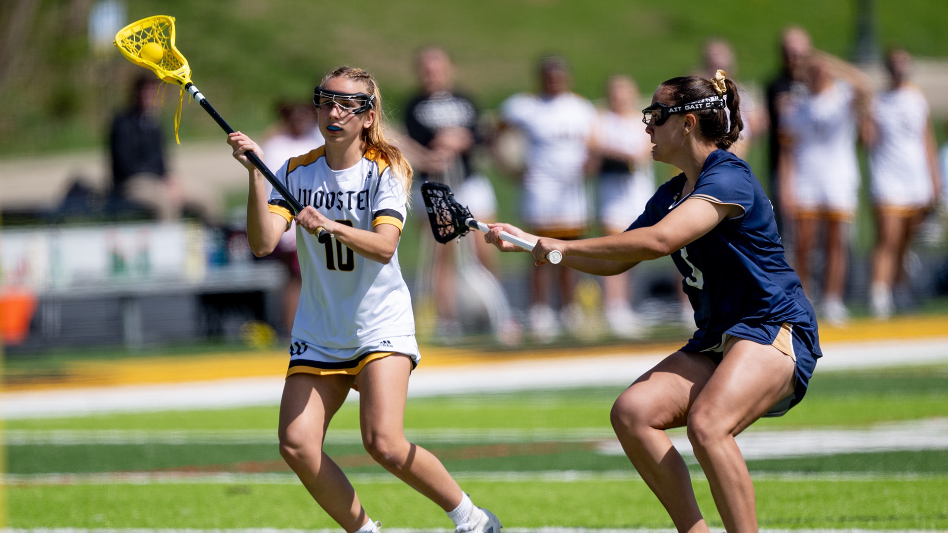 Lizzie Hardy looks to make a pass to an open teammate in a 2026 game against John Carroll
