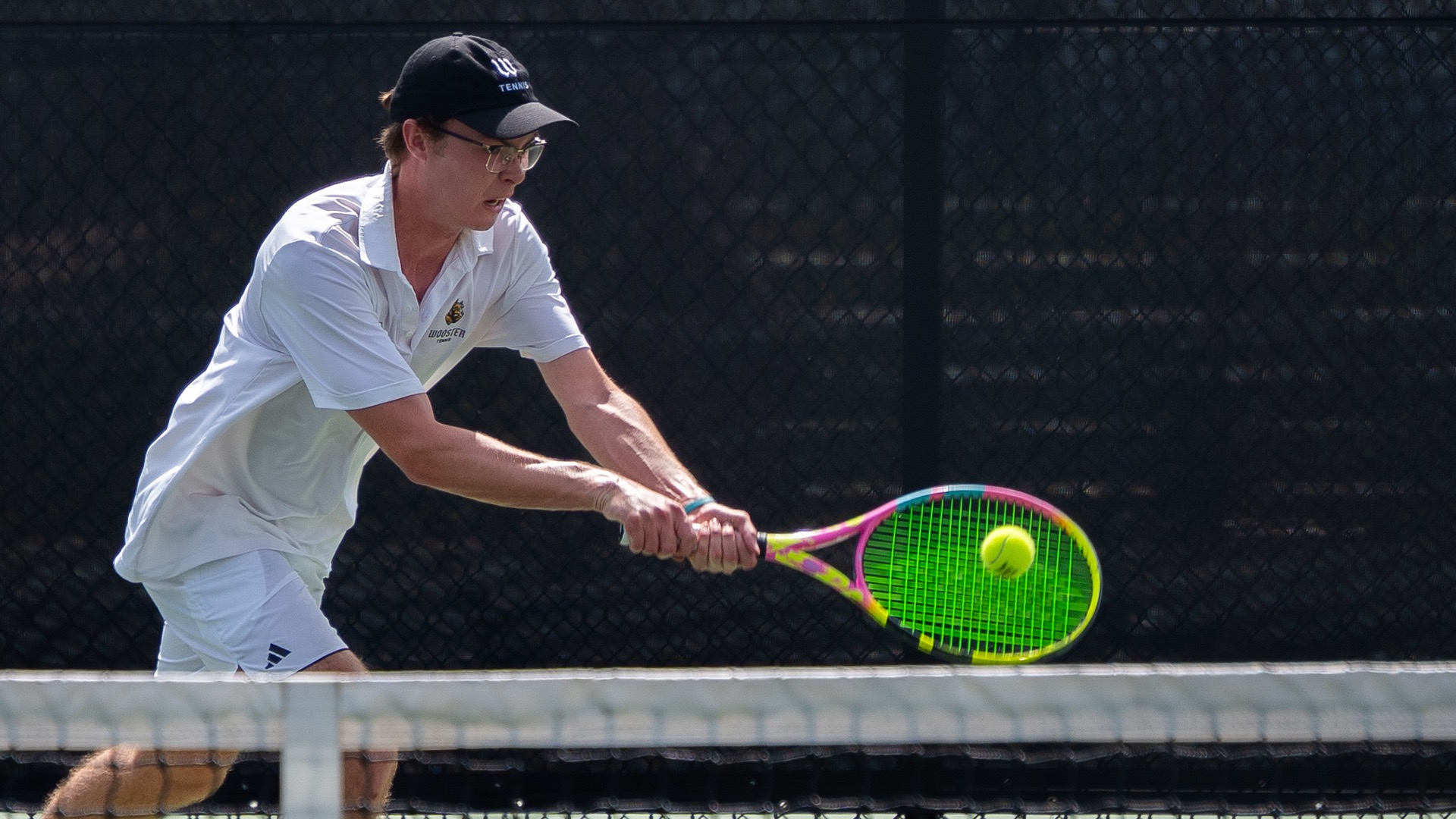 Walker Wood hits a backhand near the baseline