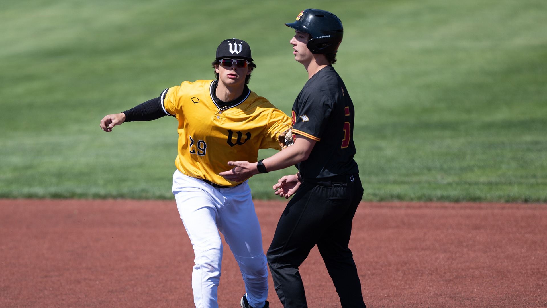Luke Rizzo tags an Oberlin player in a 2026 game