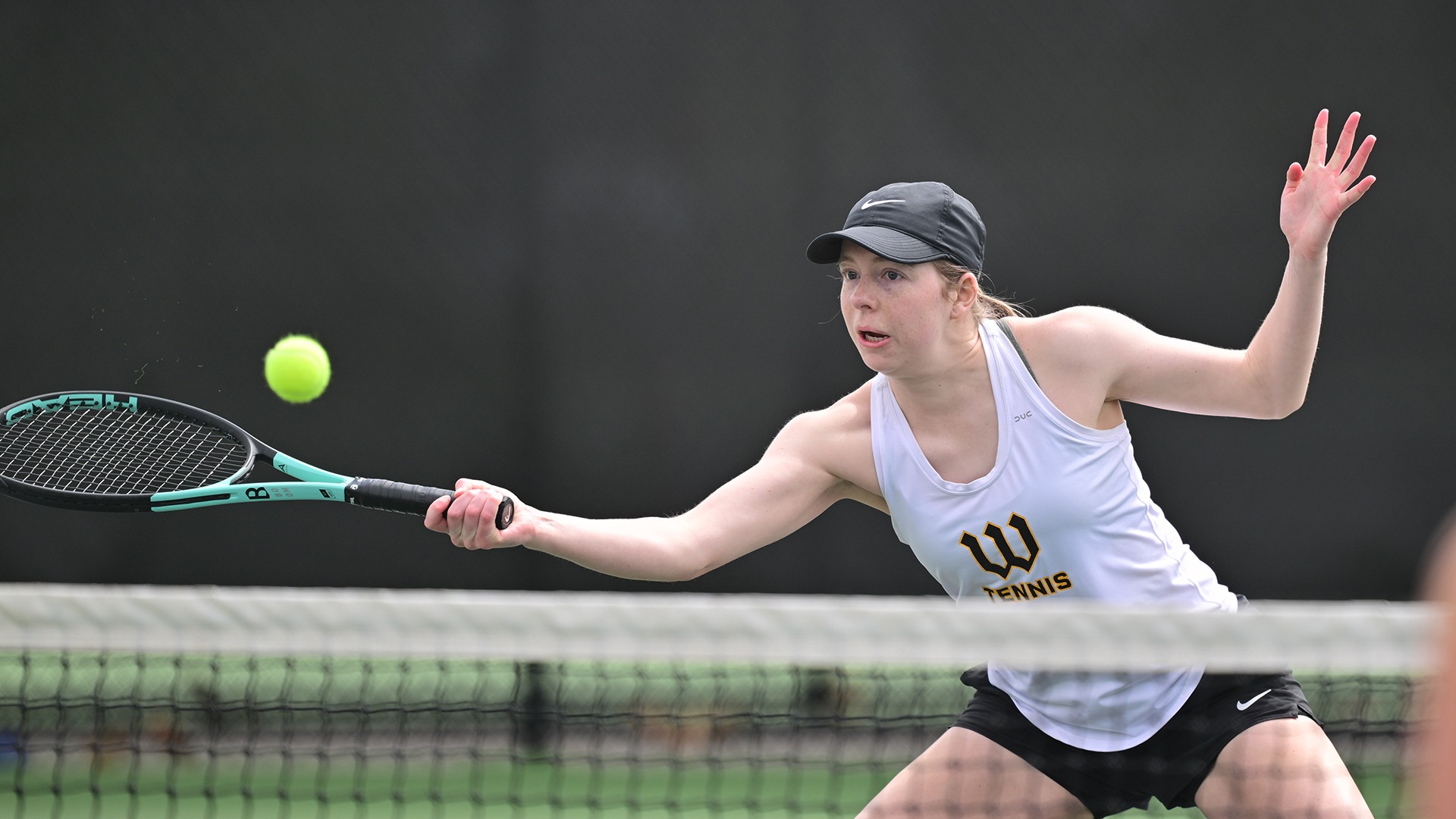 Abby Williams keeps a doubles point alive against John Carroll in 2026
