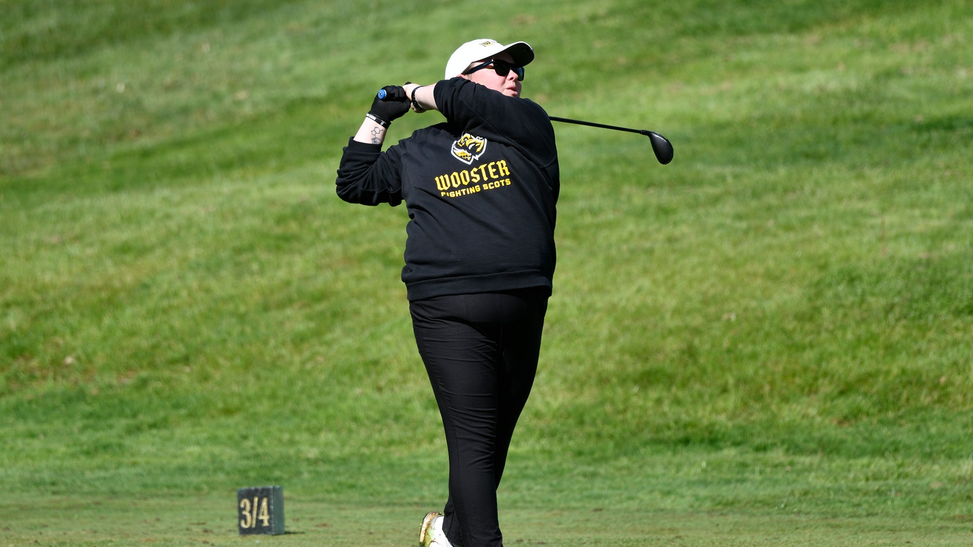 Abby Haywood watches a tee shot at the 2026 NCAC Championship