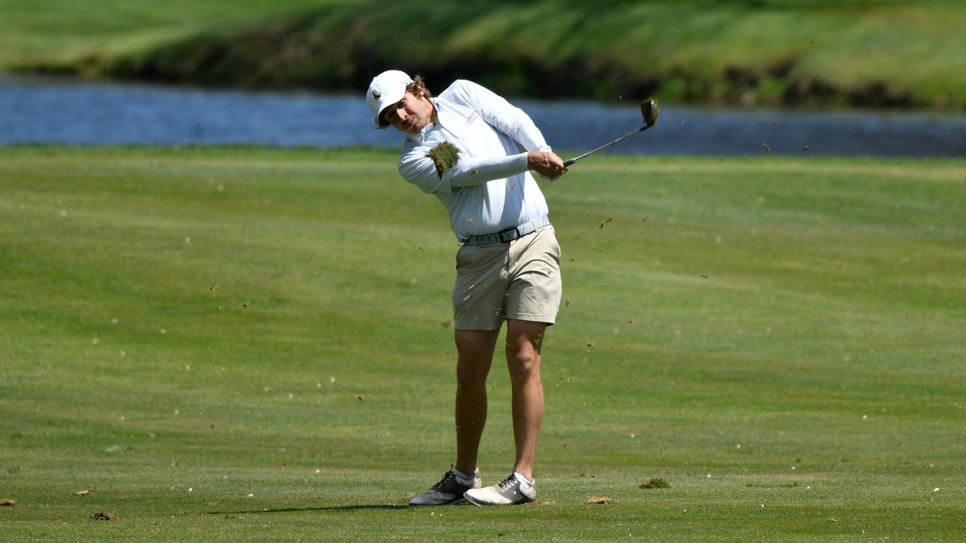 Mark Towns follows through on a wedge shot at the NCAC Championship