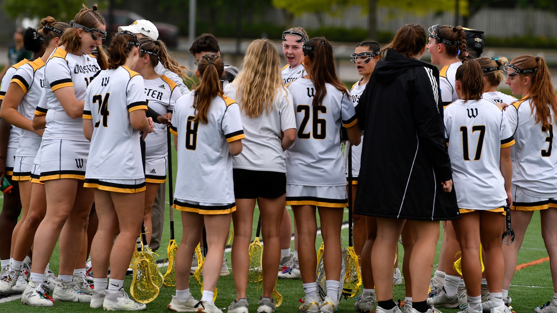 The women's lacrosse team huddles during their 2026 postseason run