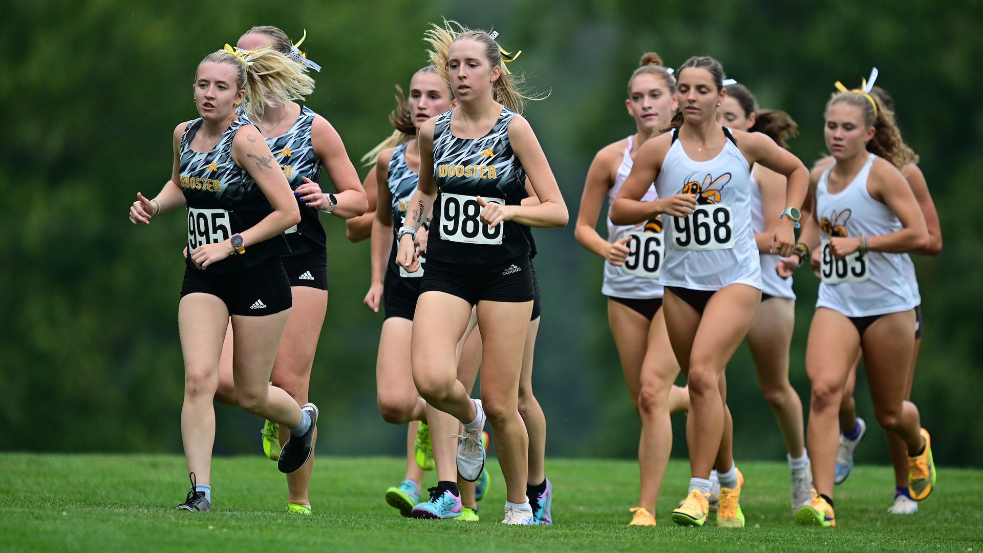 Wooster runs in a pack near the start of the race, led by first-year Stella Anderson 