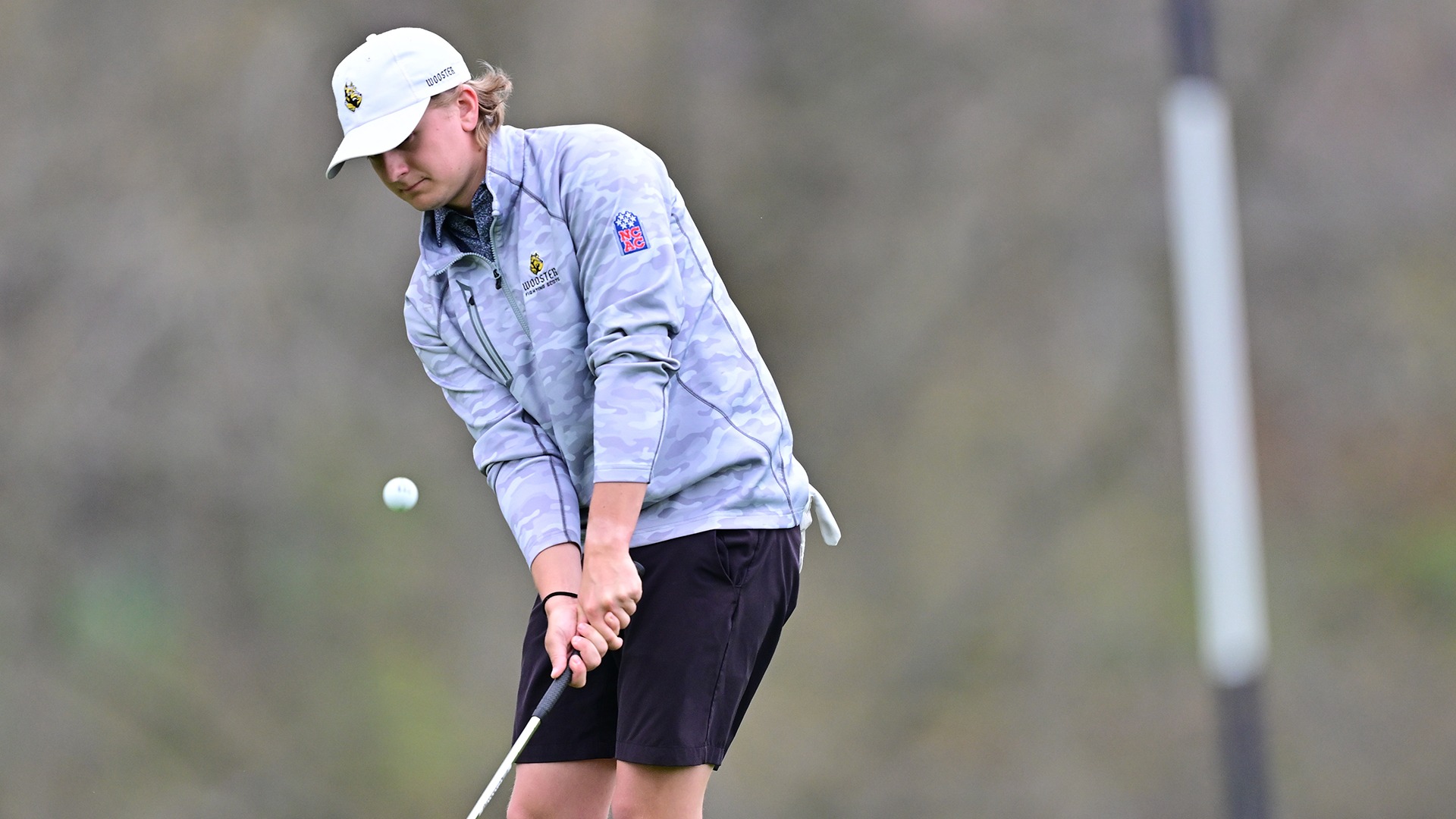 action photo of Andrew Carey chipping during the 2026 Nye Intercollegiate