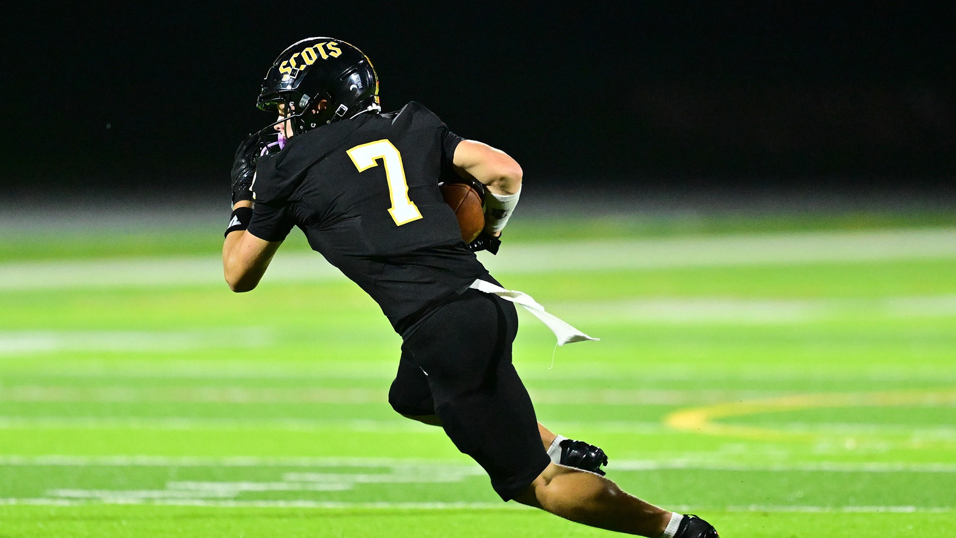 action photo of Logan Hupp running with the football after a reception