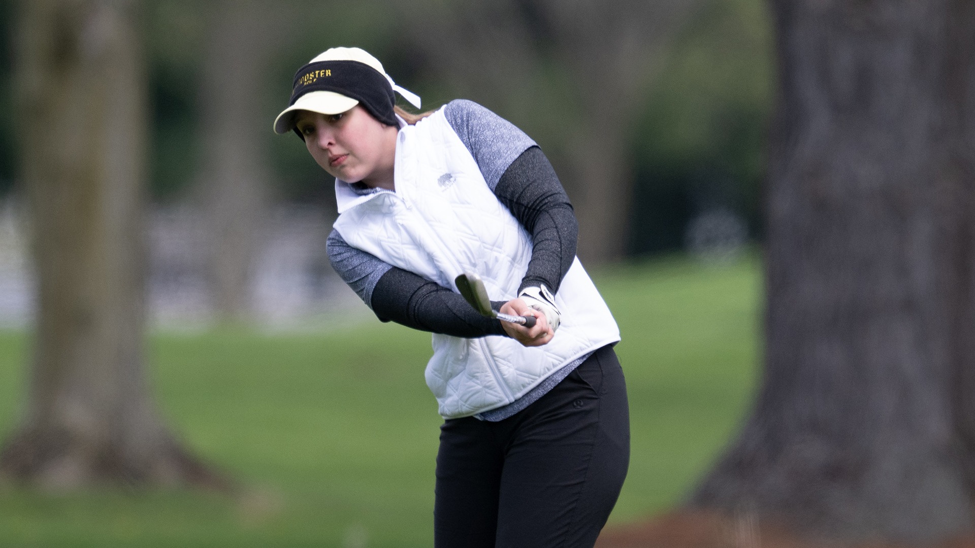 action photo of Morgan Erdmann following through on a chip during the 2026 Eva Shorb Weiskopf Invitational