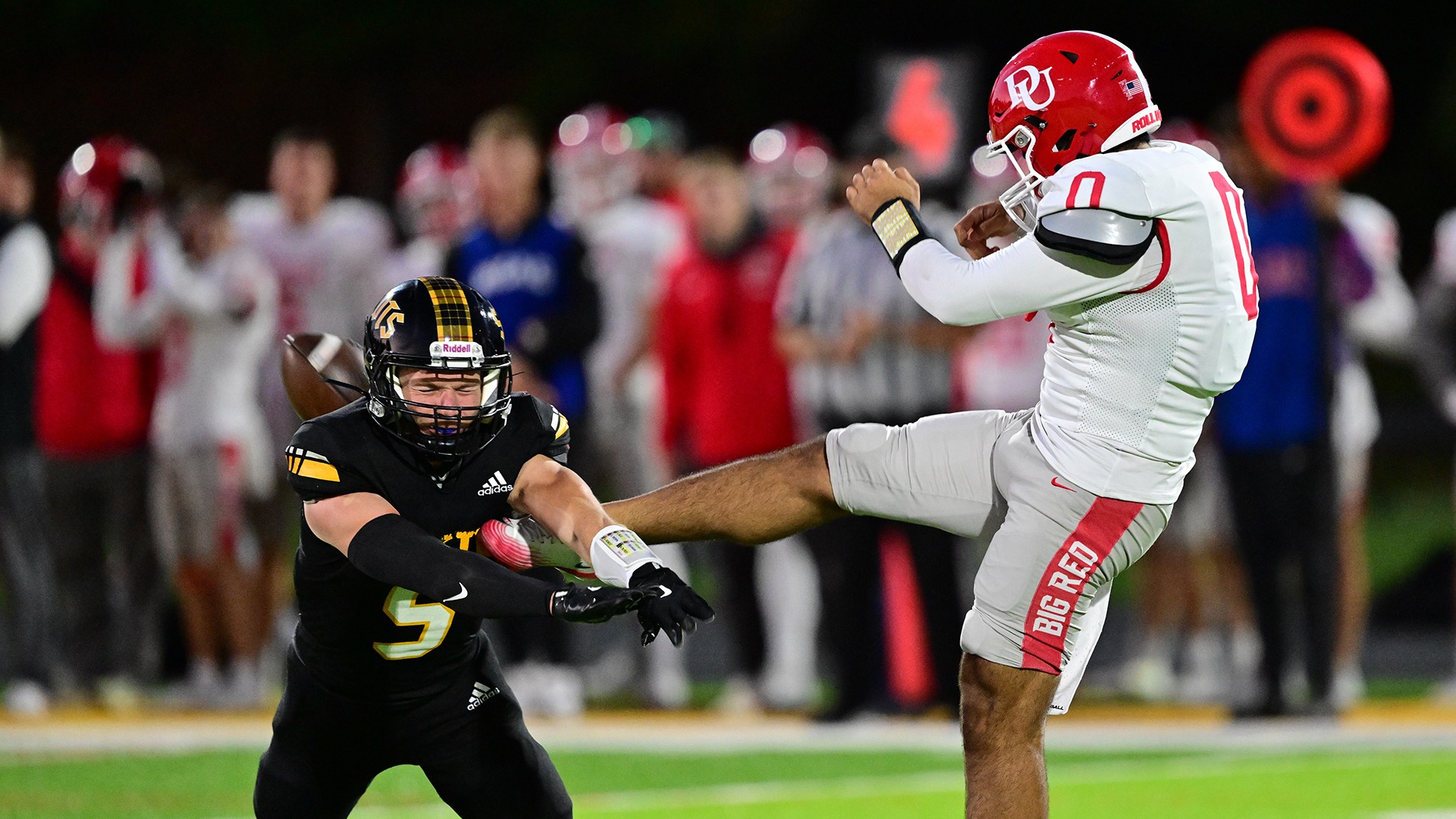 action photo of Brock Sivon blocking punt during the 2025 season against Denison