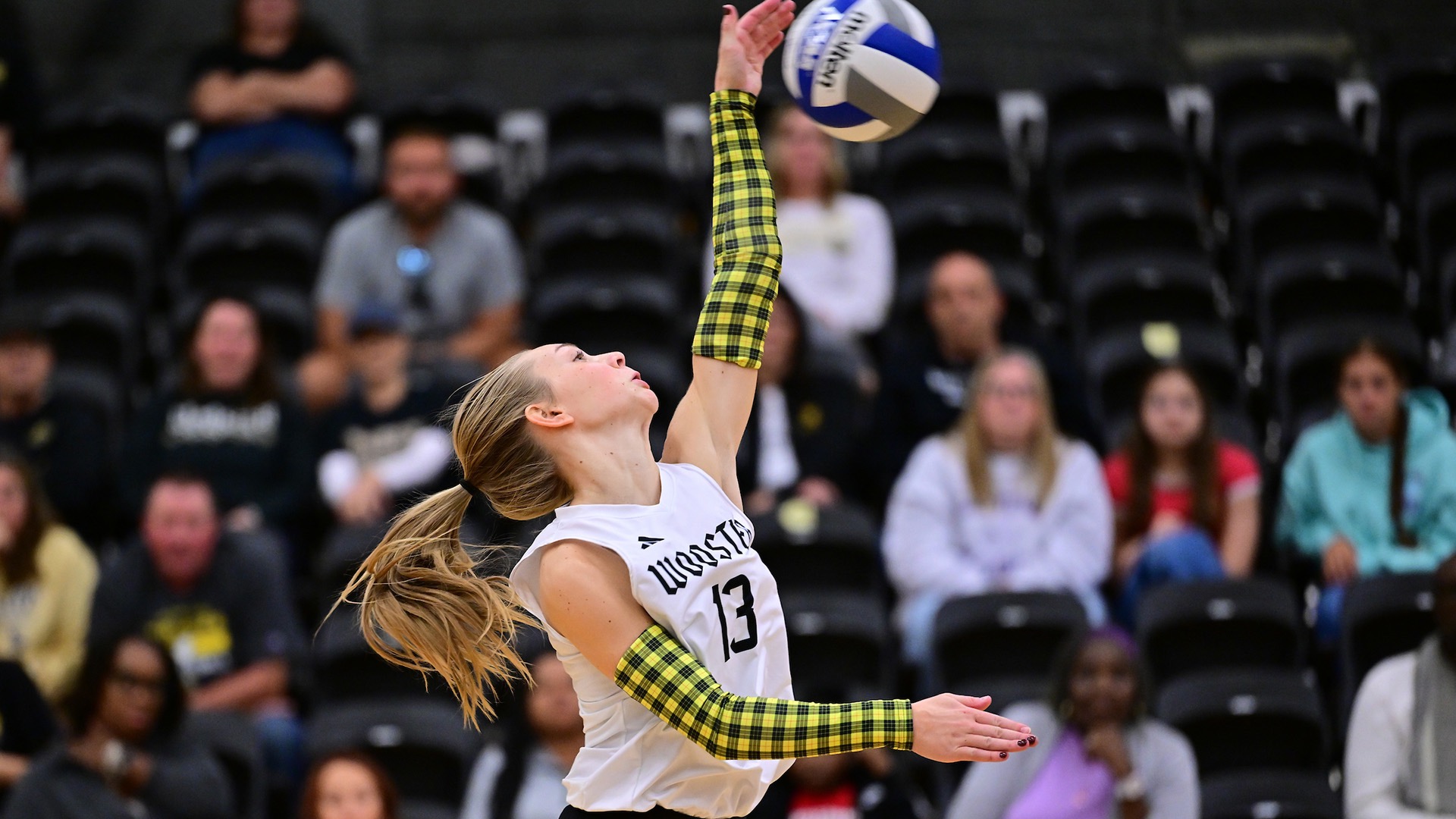 Caitlin Walsh-Knouff leads for a spike against Kenyon