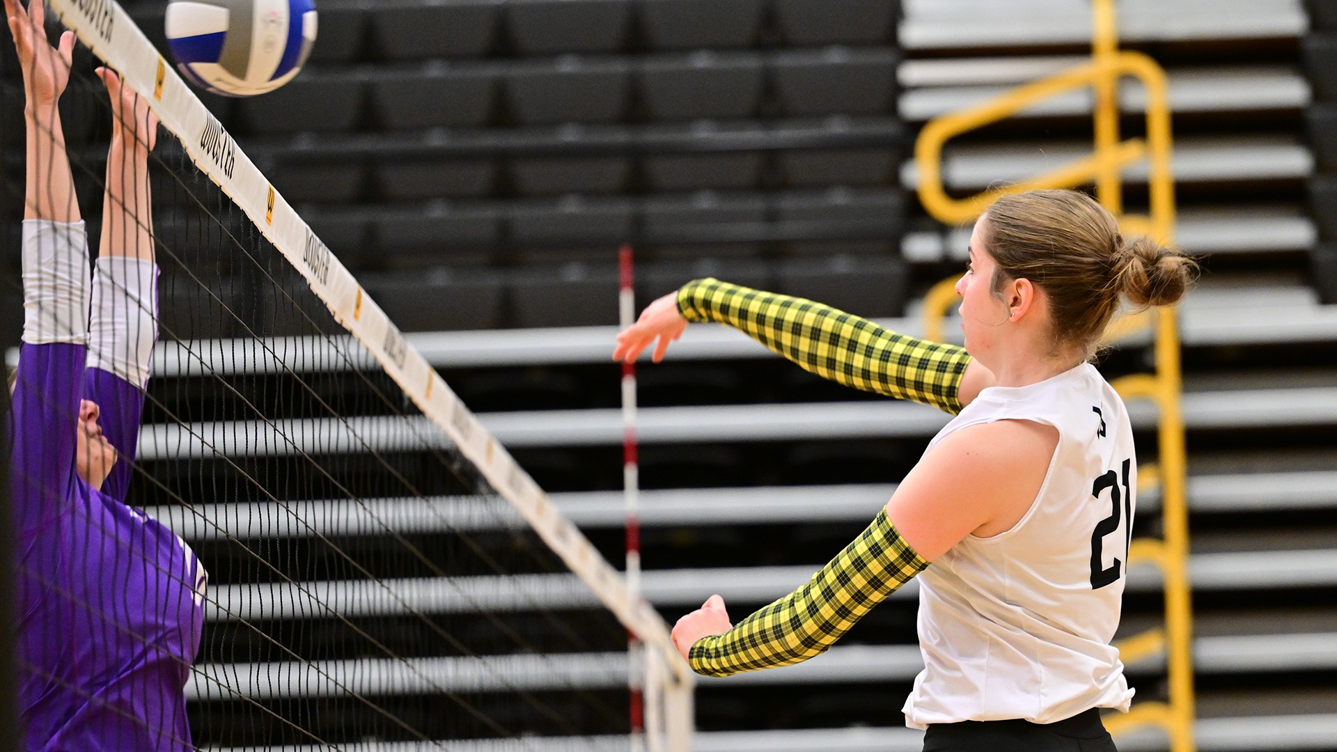 action photo of Kora Burill attacking the ball against Kenyon in a 2026 match