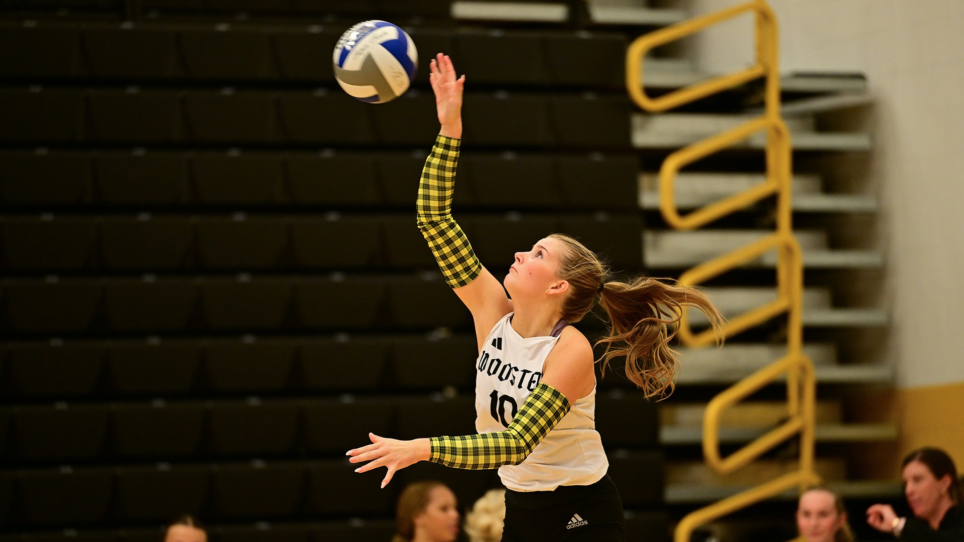 action photo of Claire Buchholz serving a volleyball in a 2026 match against Allegheny