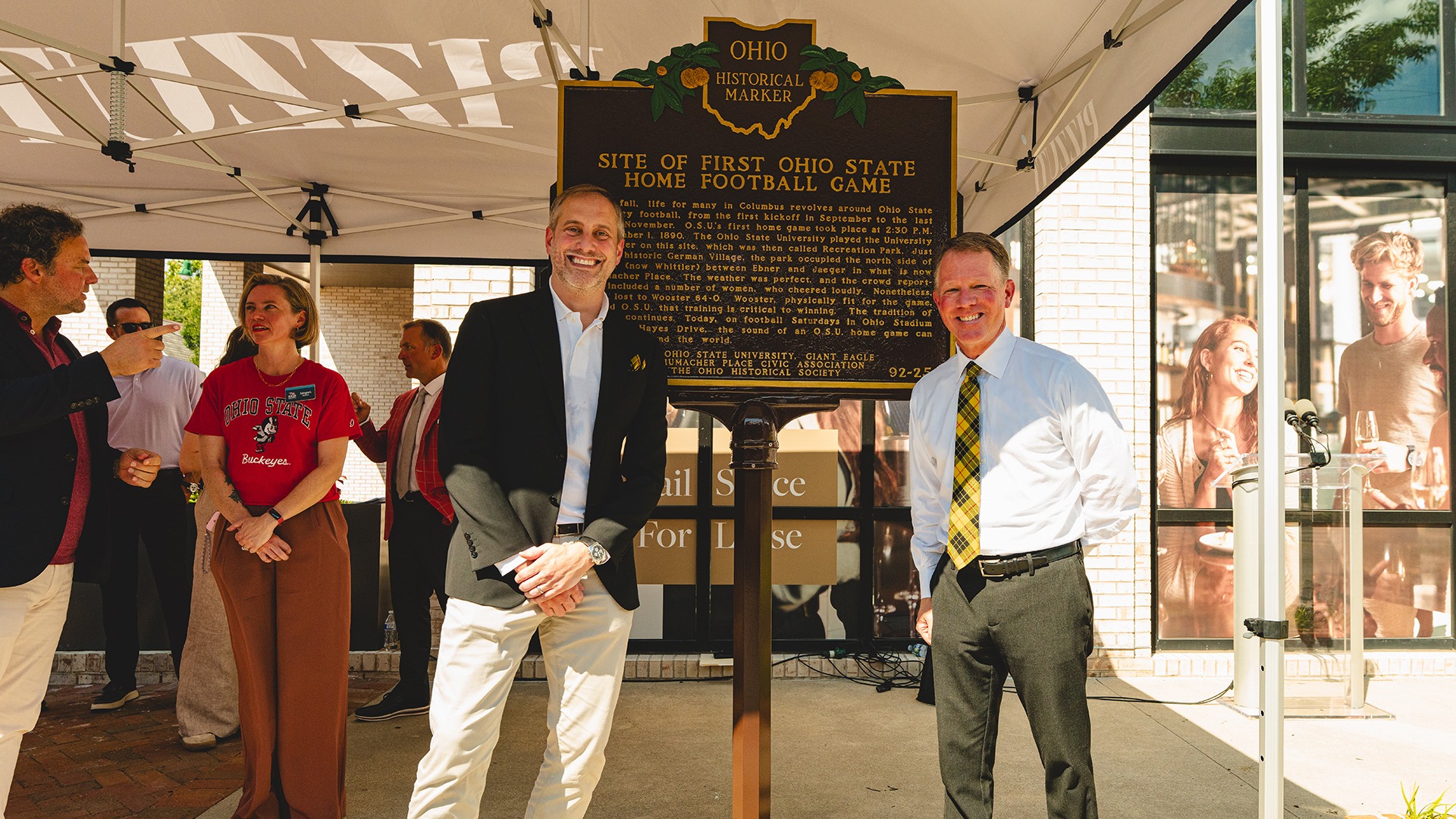 Photo of Ryan Burgess and Marcus Fowler with the Ohio Historical Marker at the site of Ohio State's first home football game