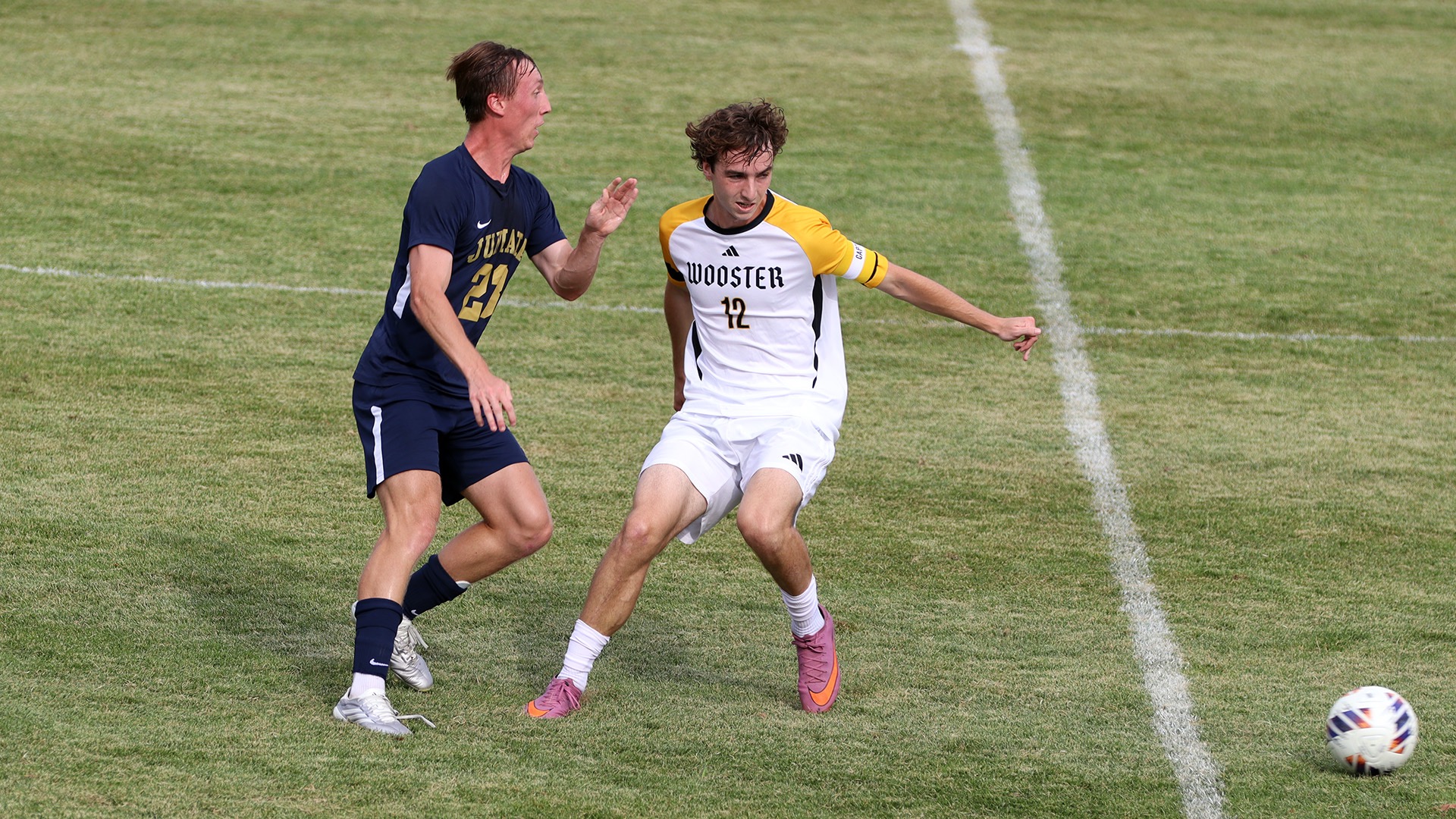 Griffin Thornton fends off a Juniata defender with the ball in the lower right corner
