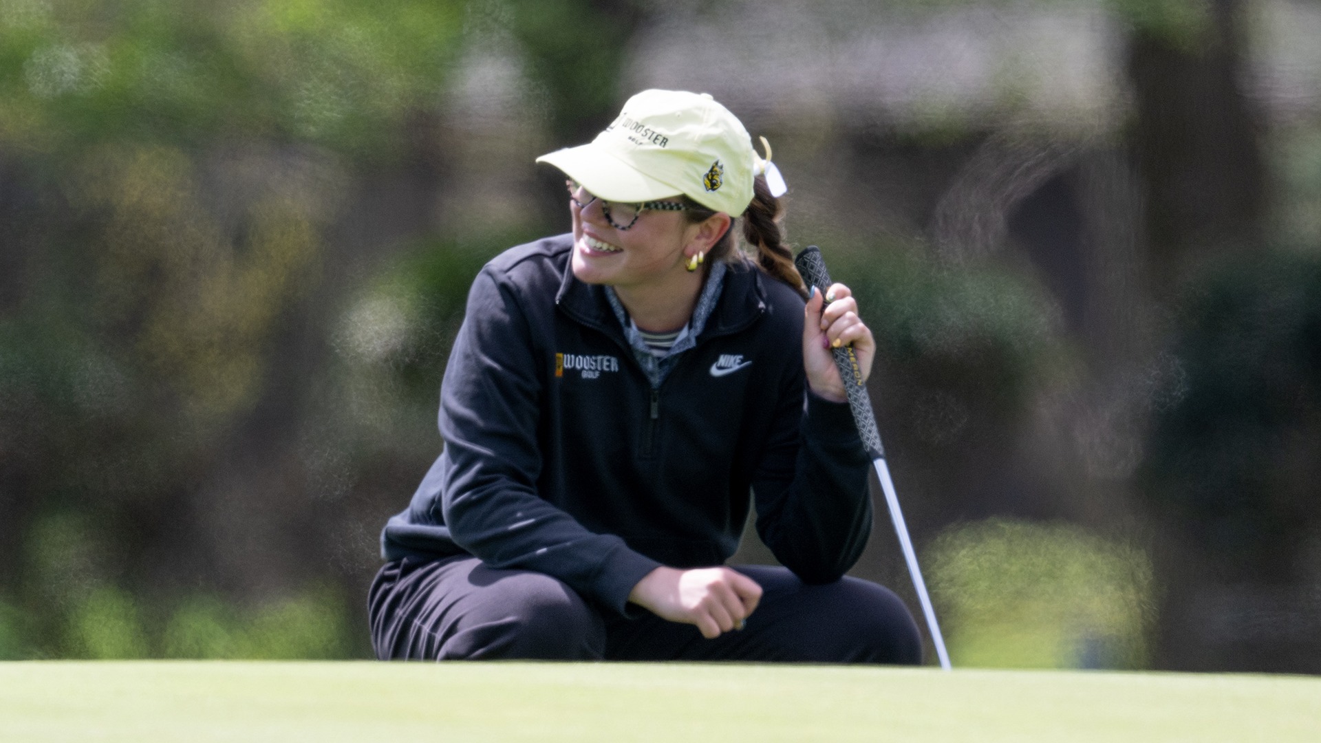 action photo of Paige Nicely smiling on a putting green during the 2026 Eva Shorb Weiskopf Invitational