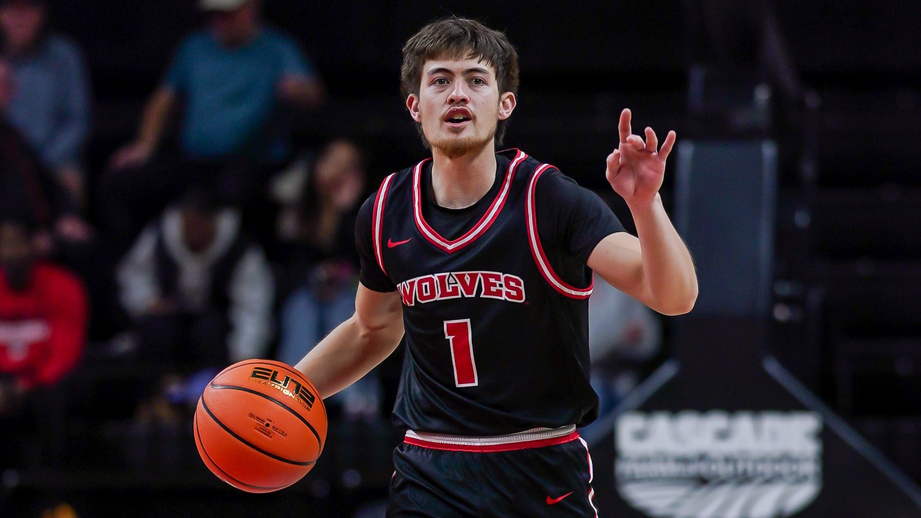 O'shen Cazimero dribbles up court