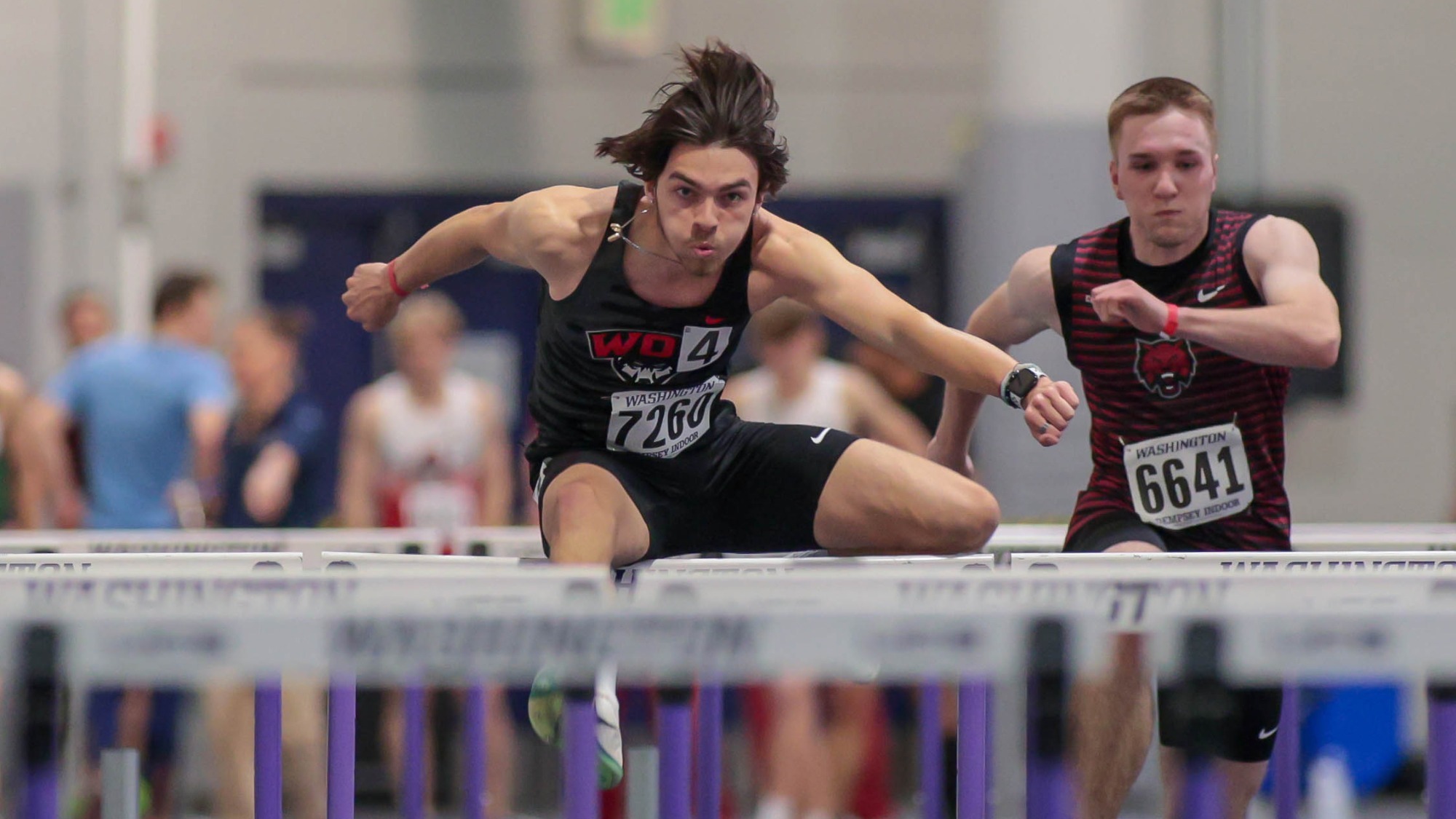McQuain competing in the hurdles at the UW Preview