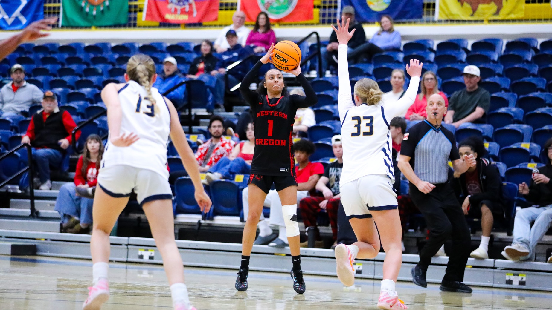 Ciona Wells shooting a 3-pointer