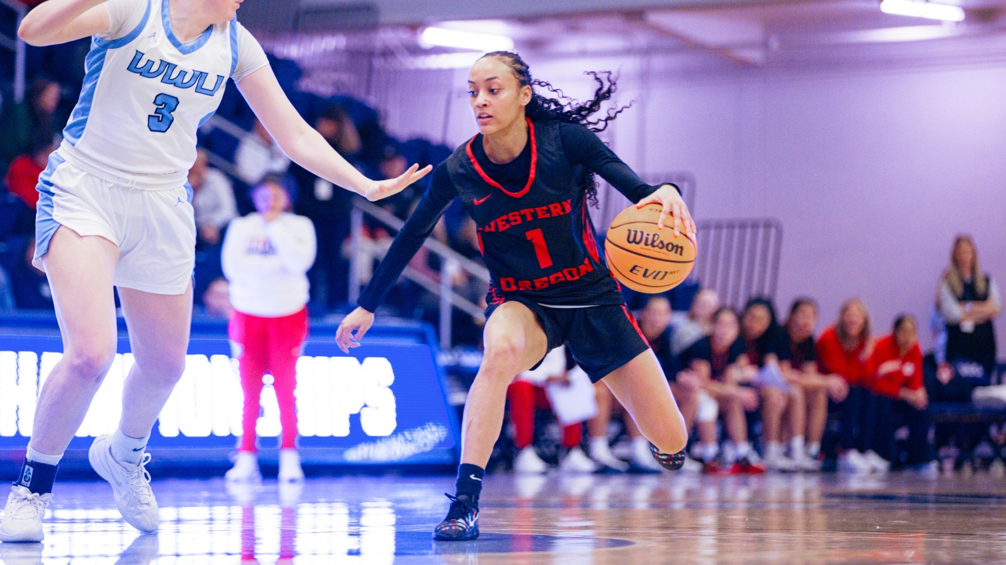 Ciona Wells dribbles against Western Washington