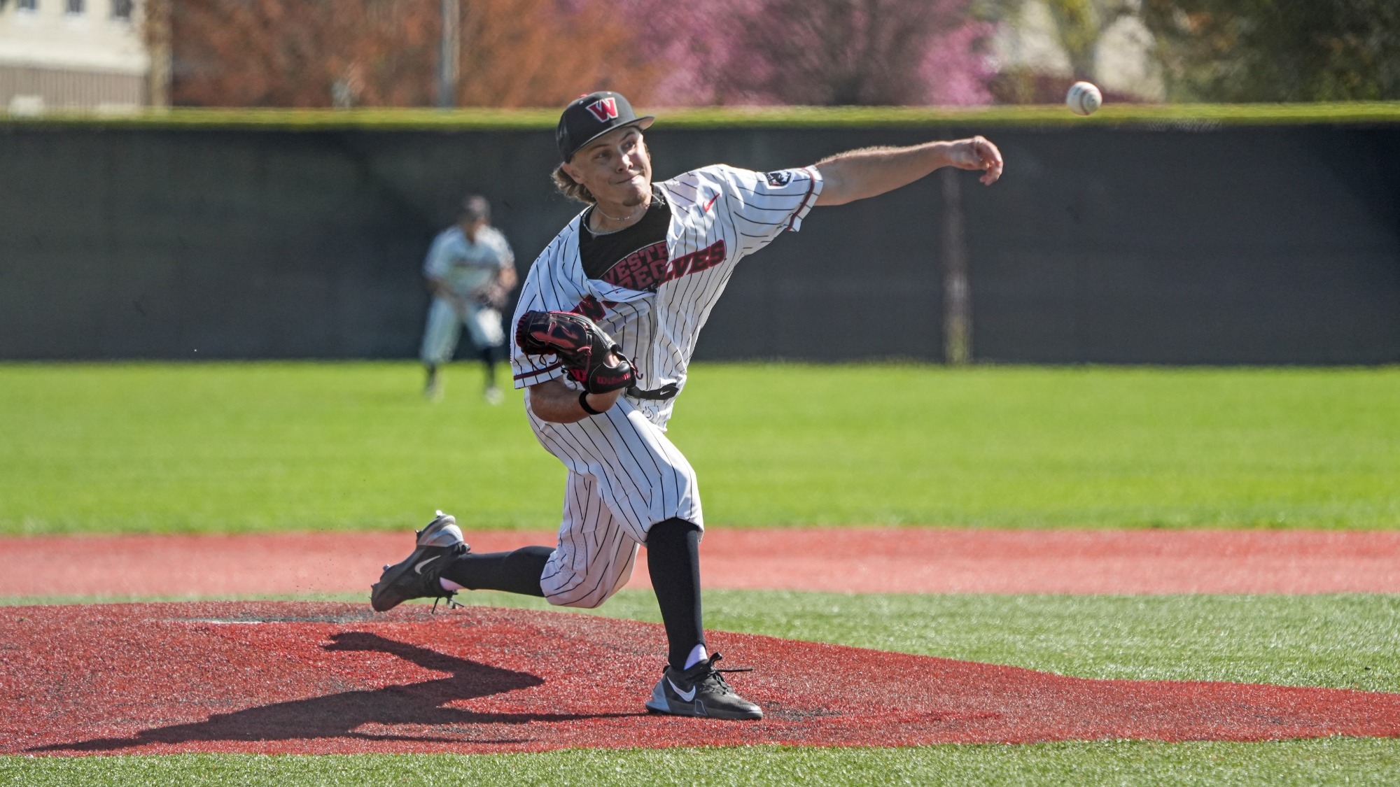 Farr throws a pitch against George Fox