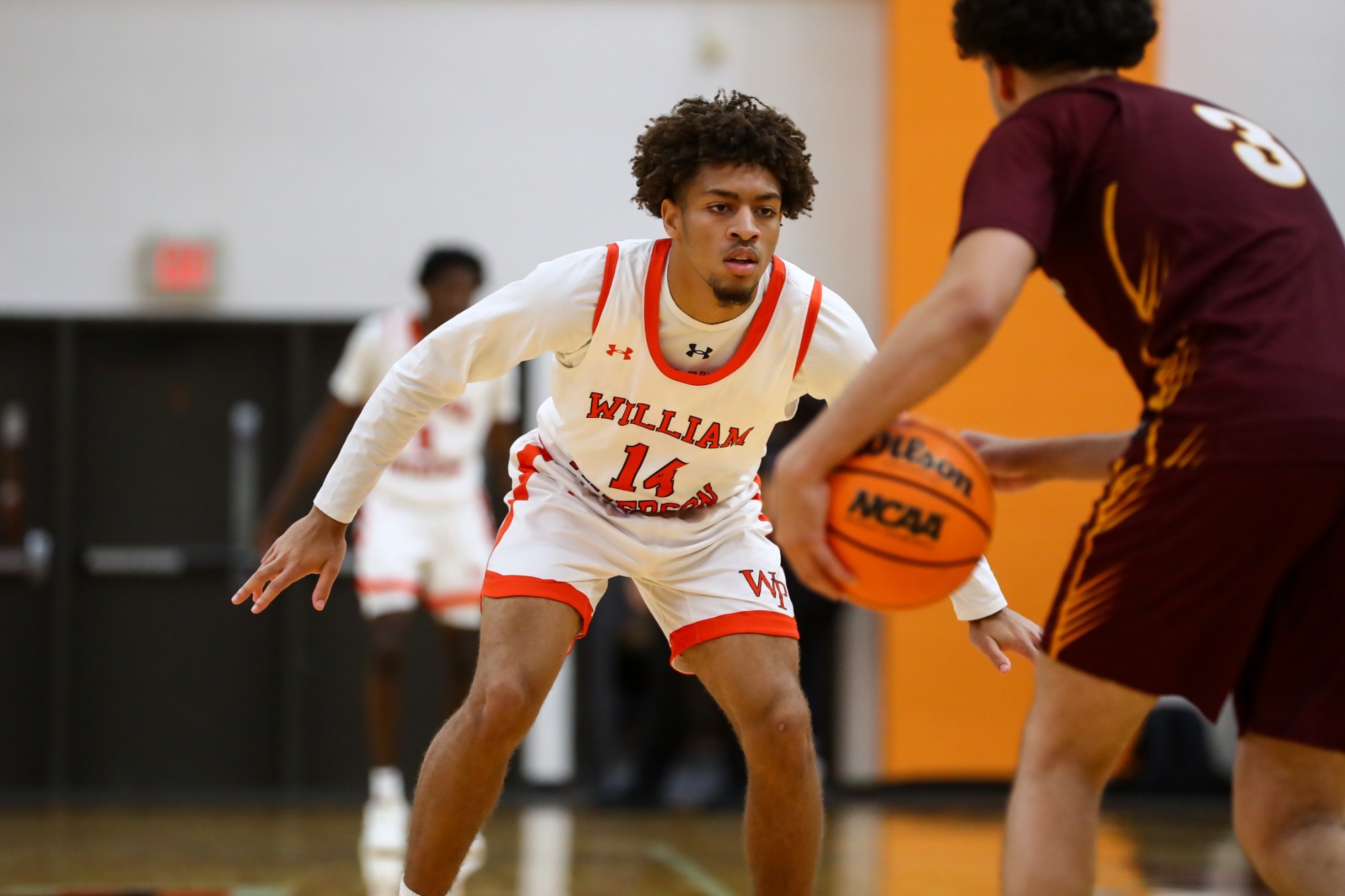 Ty'Shawn Pearson defends the ball handler for Brooklyn.