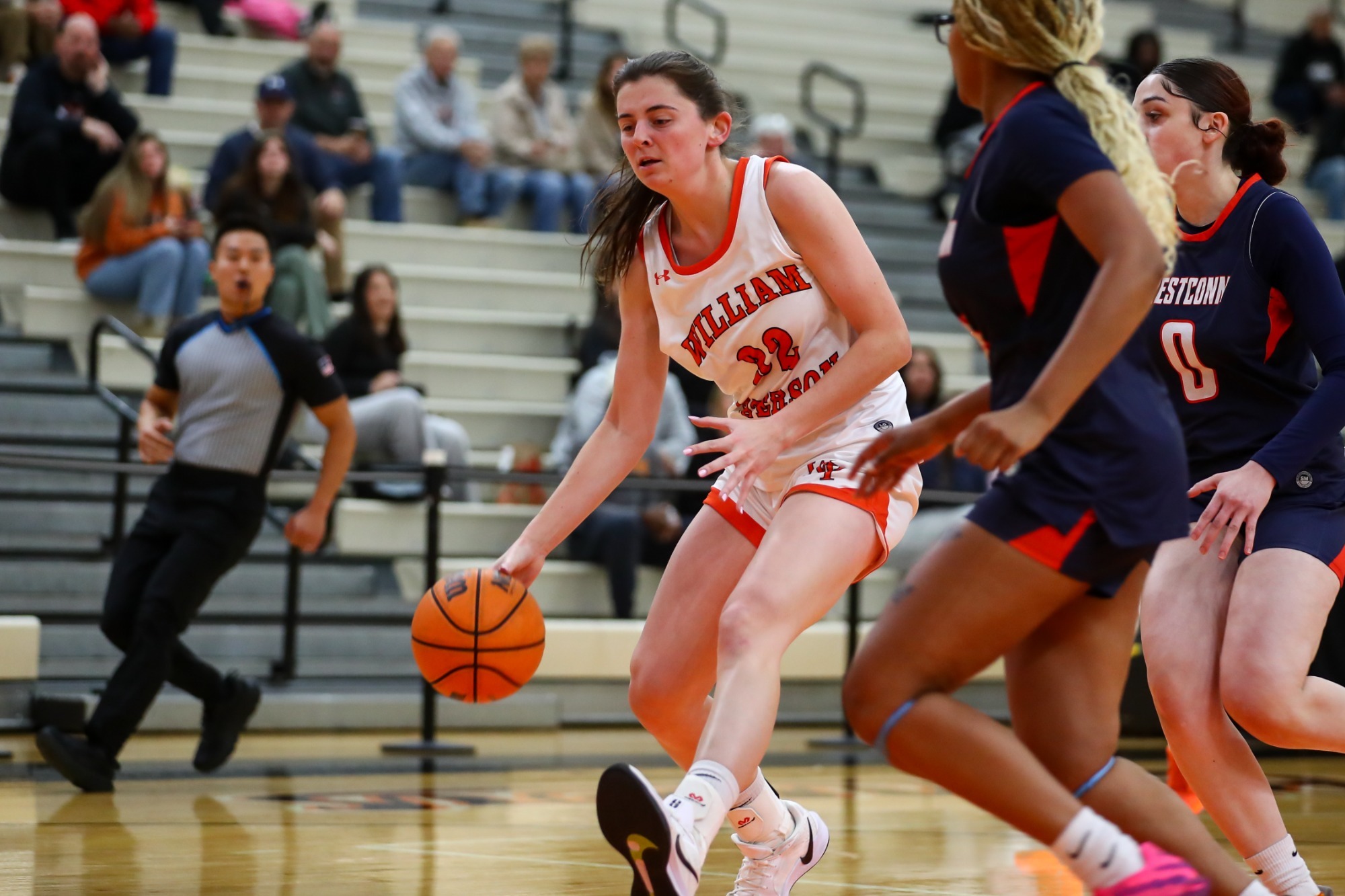 Megan Sears drives to the basket against WestConn