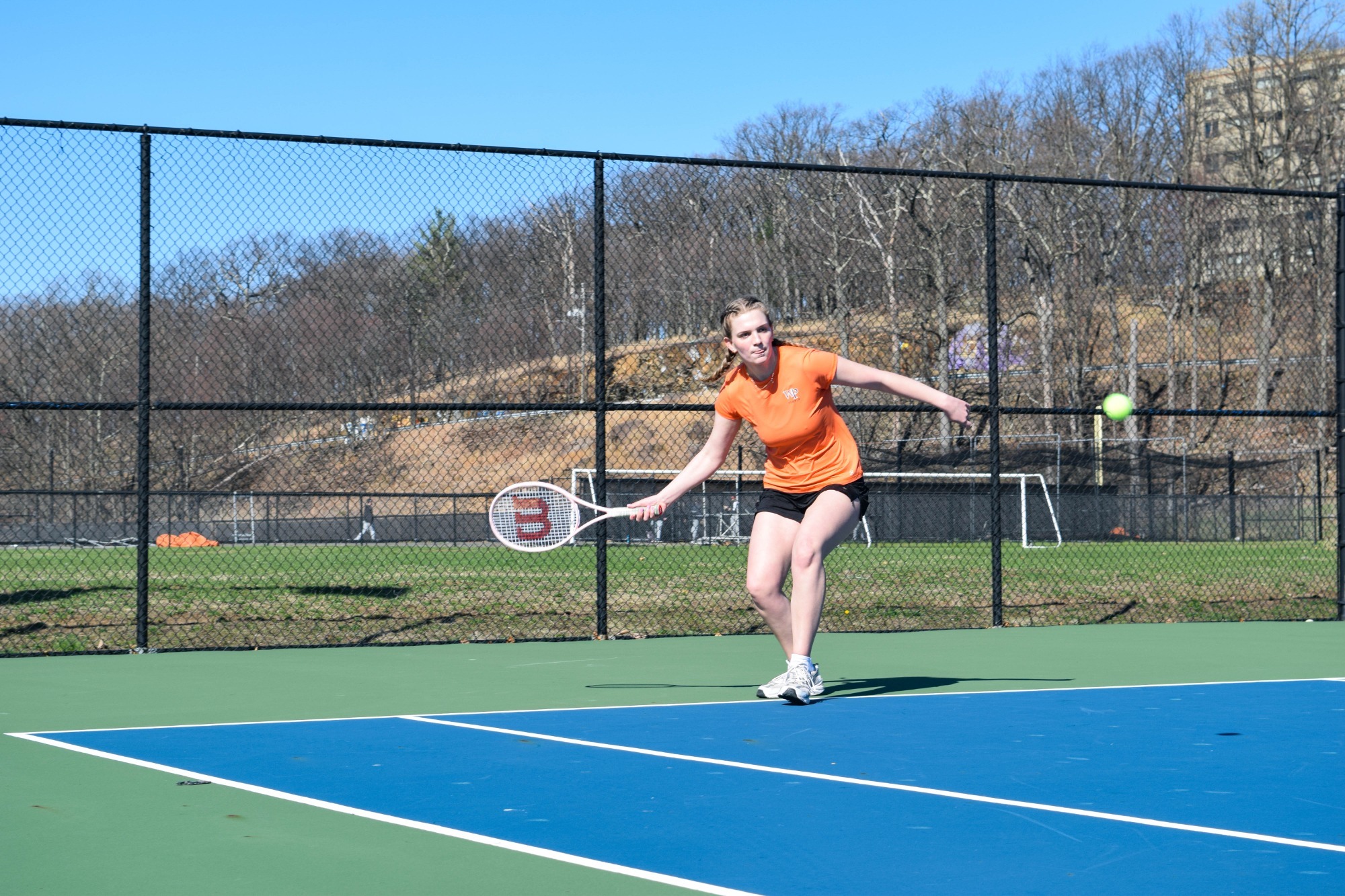 Makayla Yancey goes to return a serve