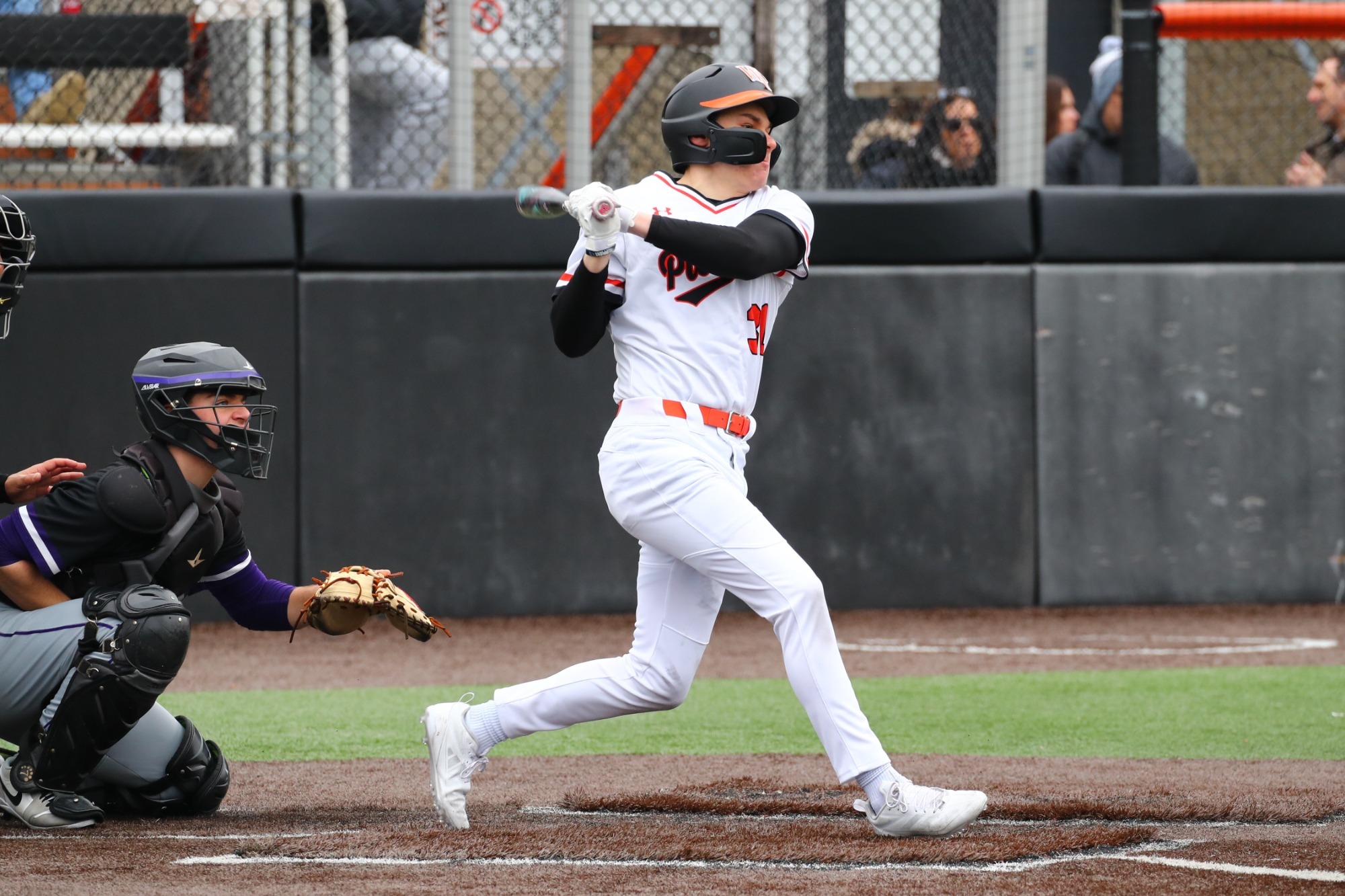 Matt Caruso lines a base hit into the outfield