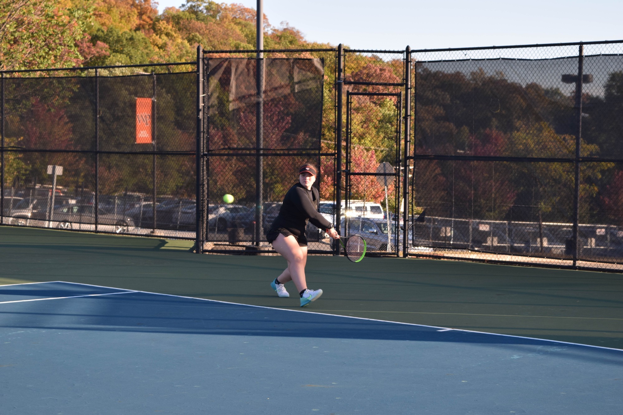 Allison Steins returns a serve against Lehman.