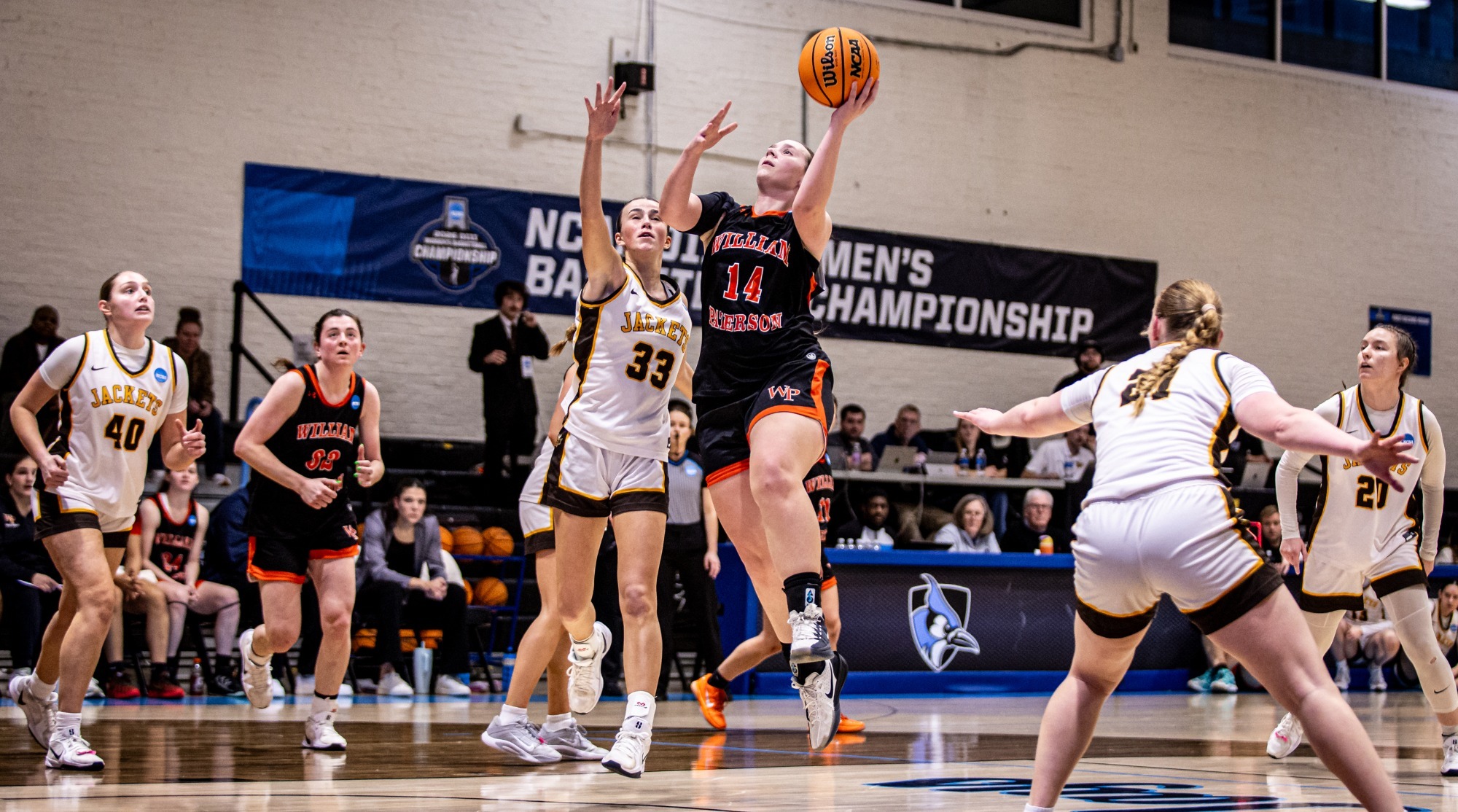 Renee Wells soars for a layup in the NCAA Tournament against Baldwin Wallace.