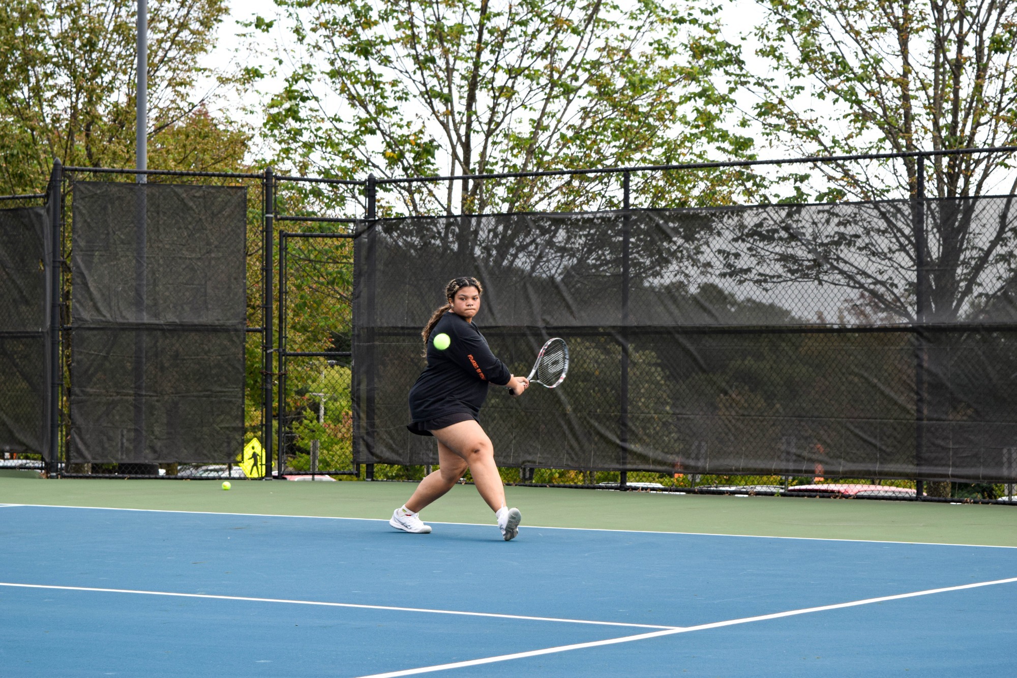 Haley Bernard returns a serve