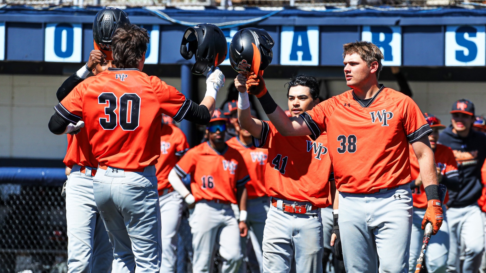 William Paterson baseball team celebrates after scoring runs at Kean.
