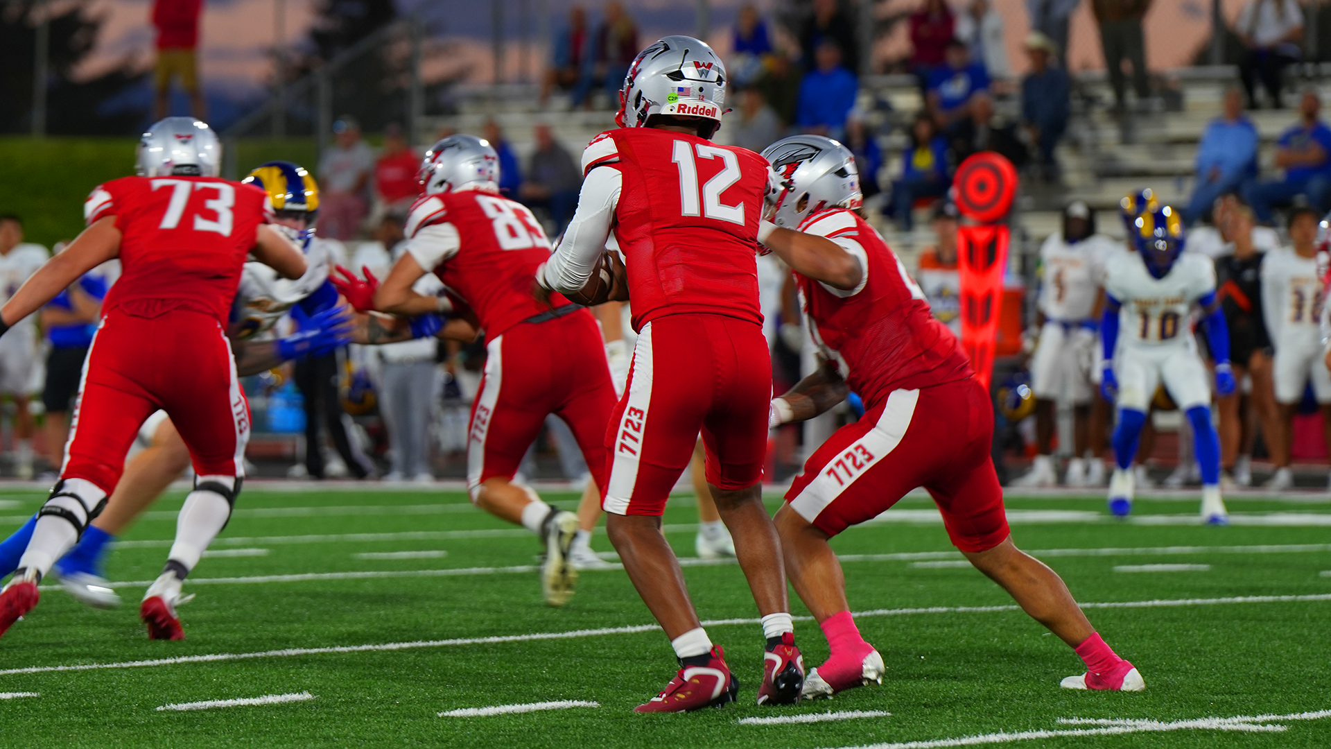 Josiah Roy hand off during win over Angelo State