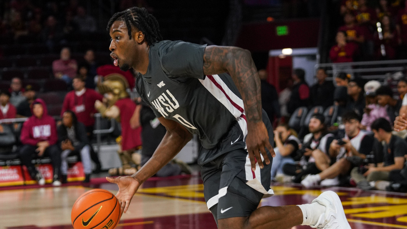 Emmanuel Ugbo brings the ball up the court against USC, Dec. 14, 2025