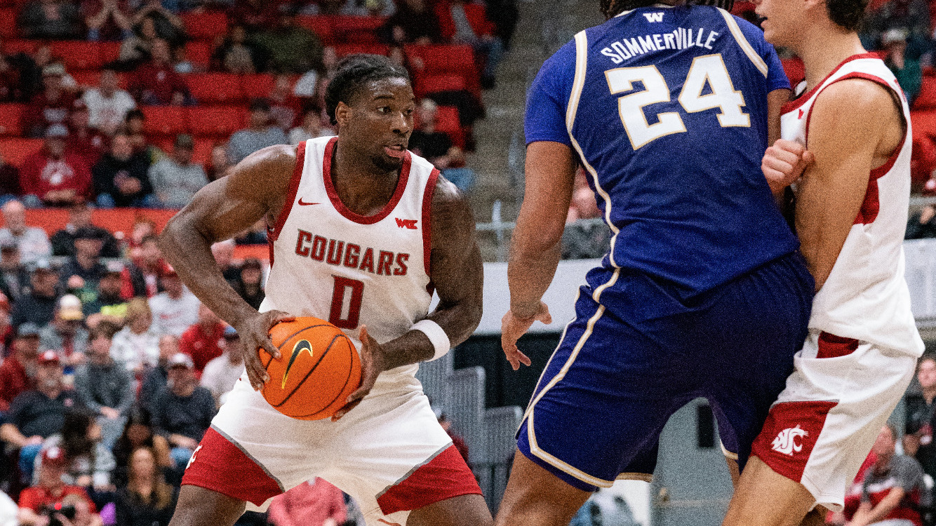 Emmanuel Ugbo looks to drive against a Washington defender