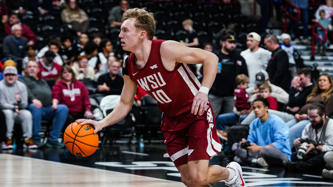 Parker Gerrits brings the ball up the court against EWU