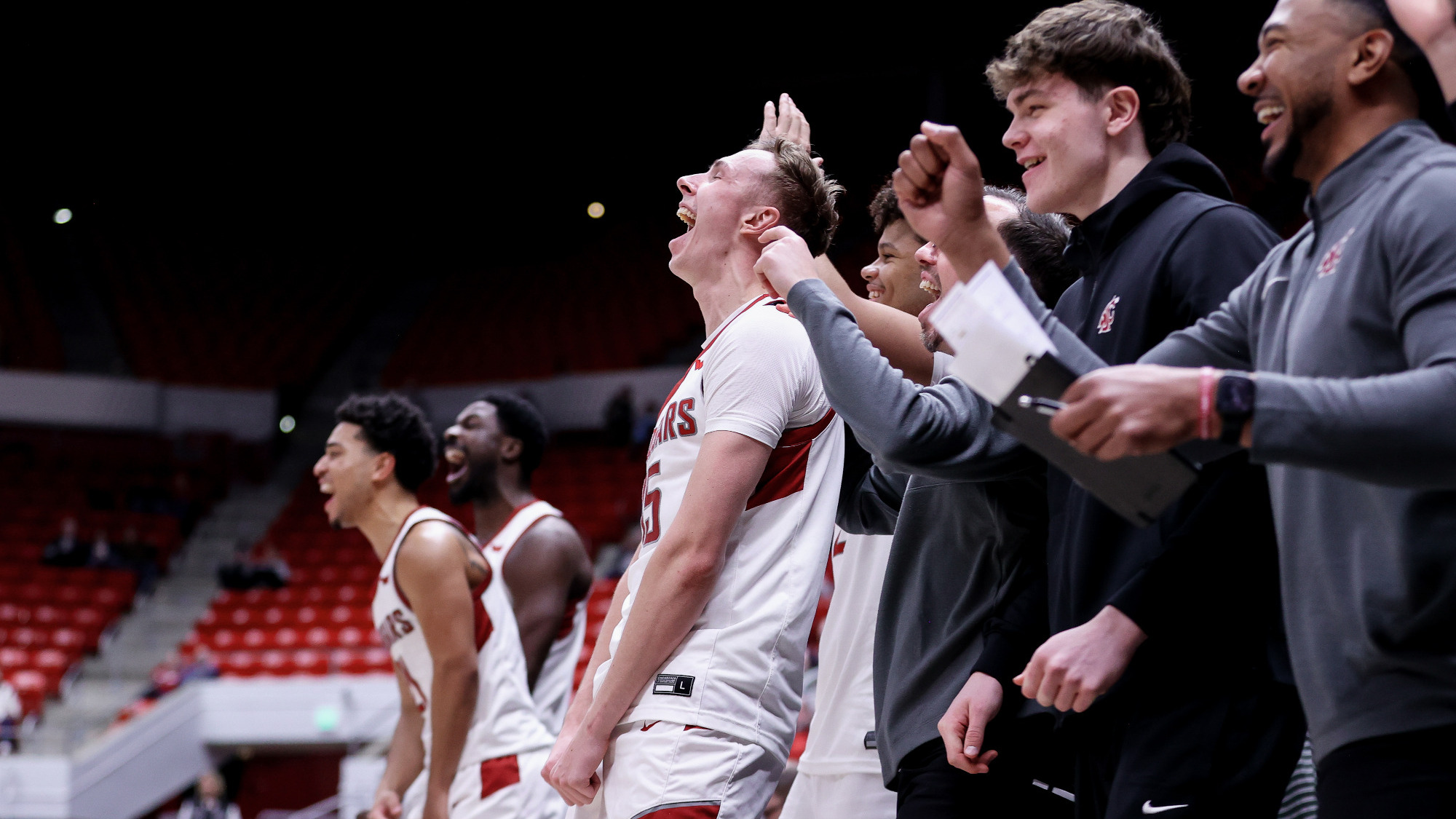 The Cougar bench celebrates the first career point for Dio Blakely, Jan. 24, 2026