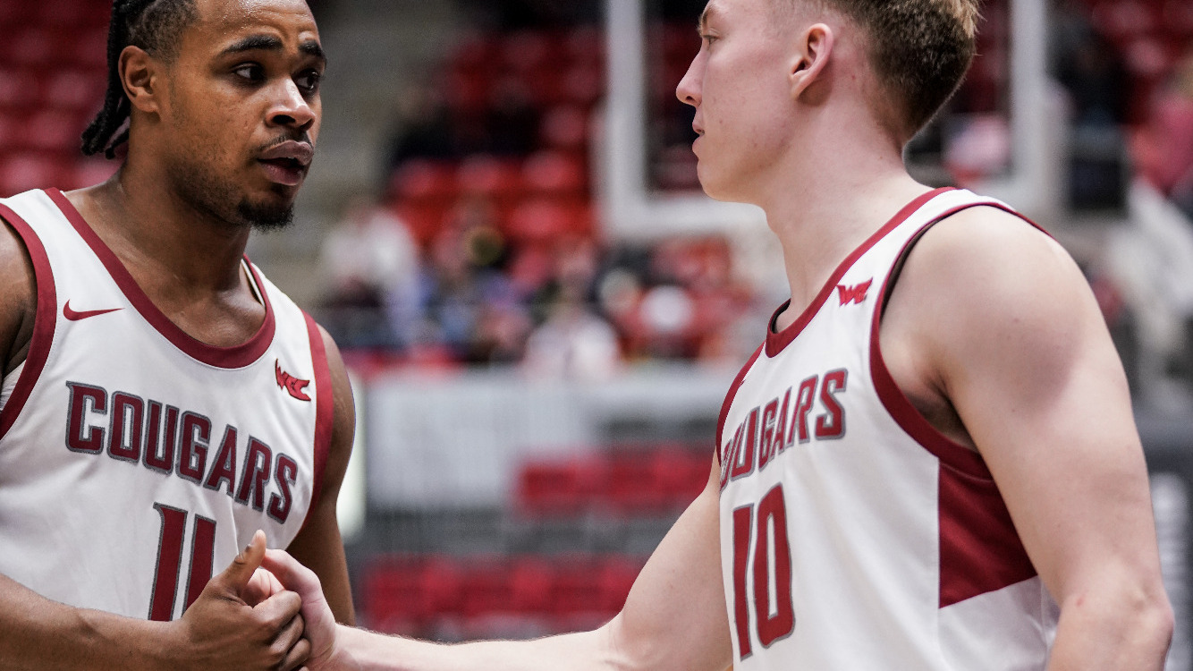 Jerone Morton and Parker Gerrits share a handshake