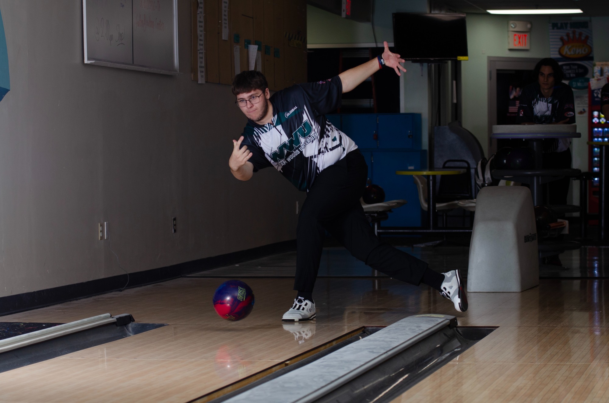 William Woods' Jonathan Bauer bowls for an action shot on media day.