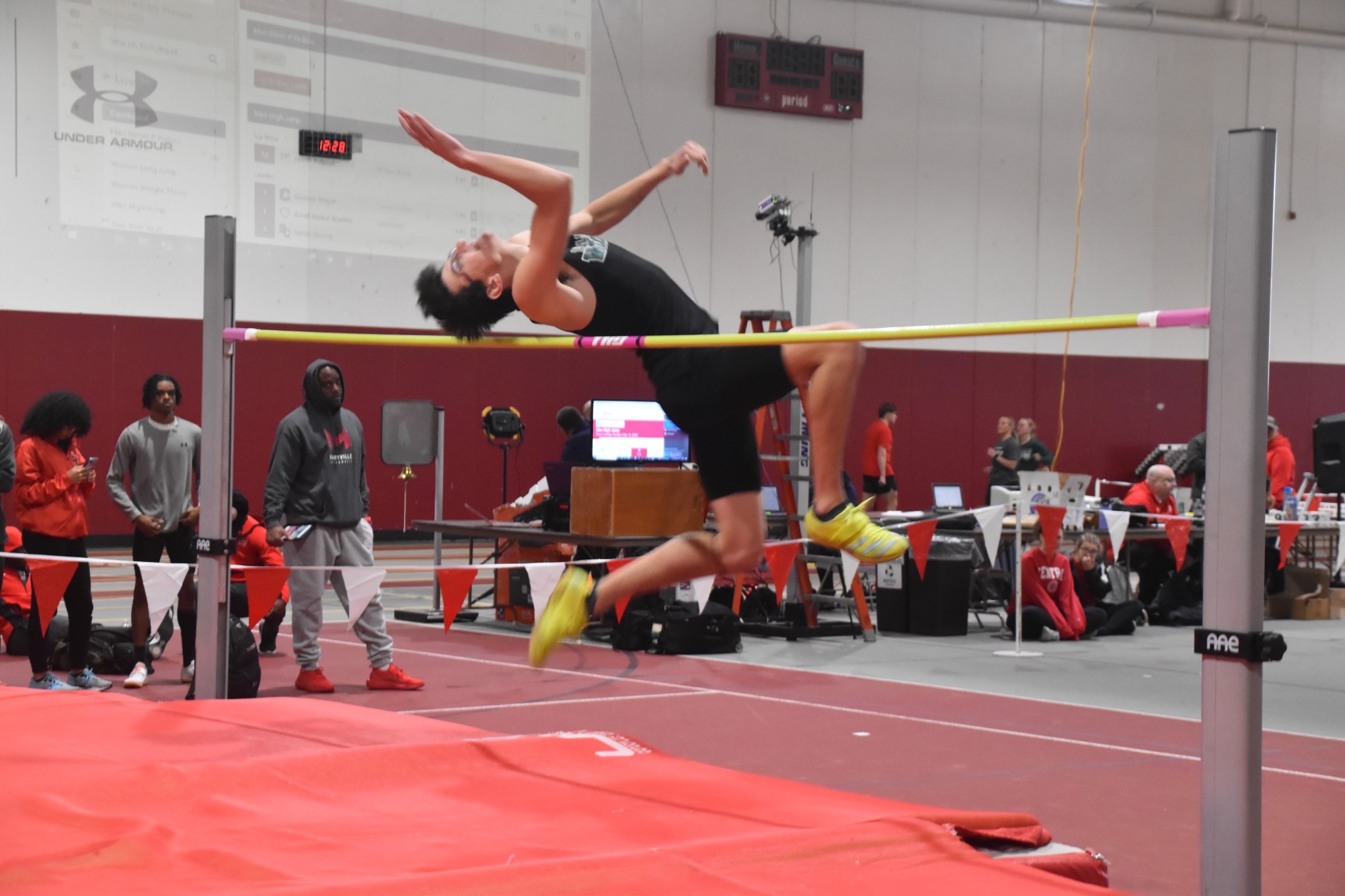 William Woods' Jacob Polacek leaps over the pole in the high jump at the Dutch Holiday Preview.