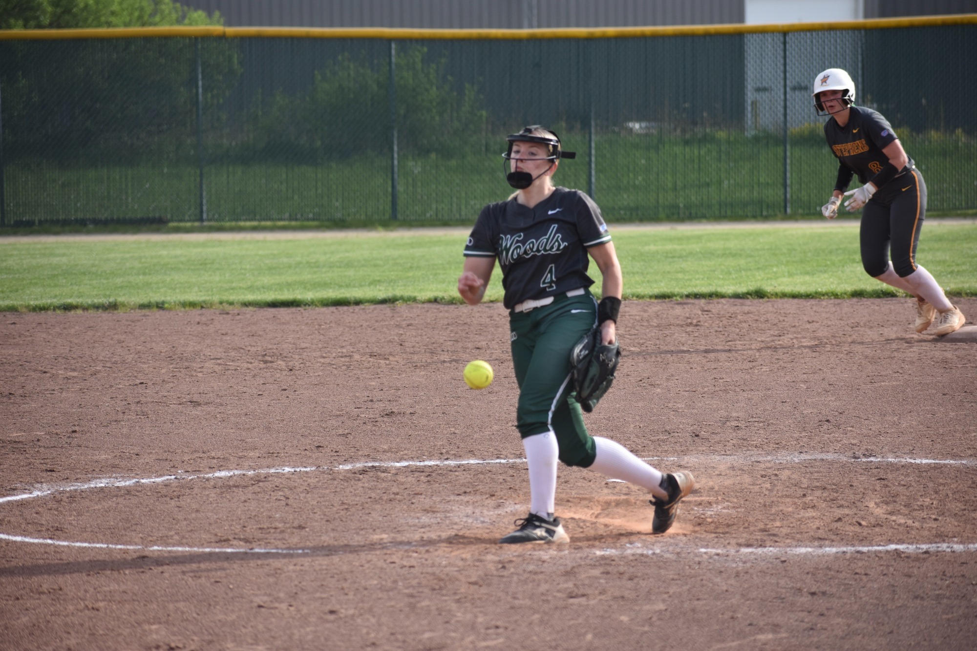 William Woods's Sarah Randermann hurls a pitch to a Stephens hitter.