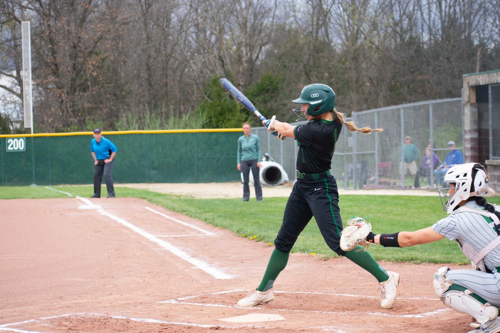 William Woods's Lexi Lewis slaps the softball.