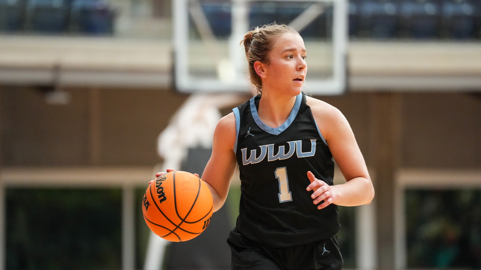 Libby Stump dribbling a basketball