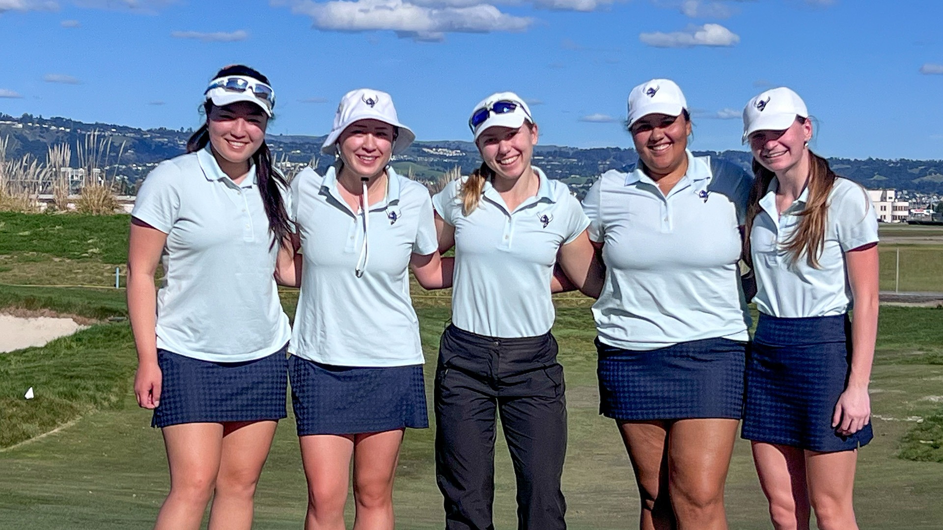 Women's Golf Team Photo at Pioneer Shootout - Five Golfers smiling on a golf course