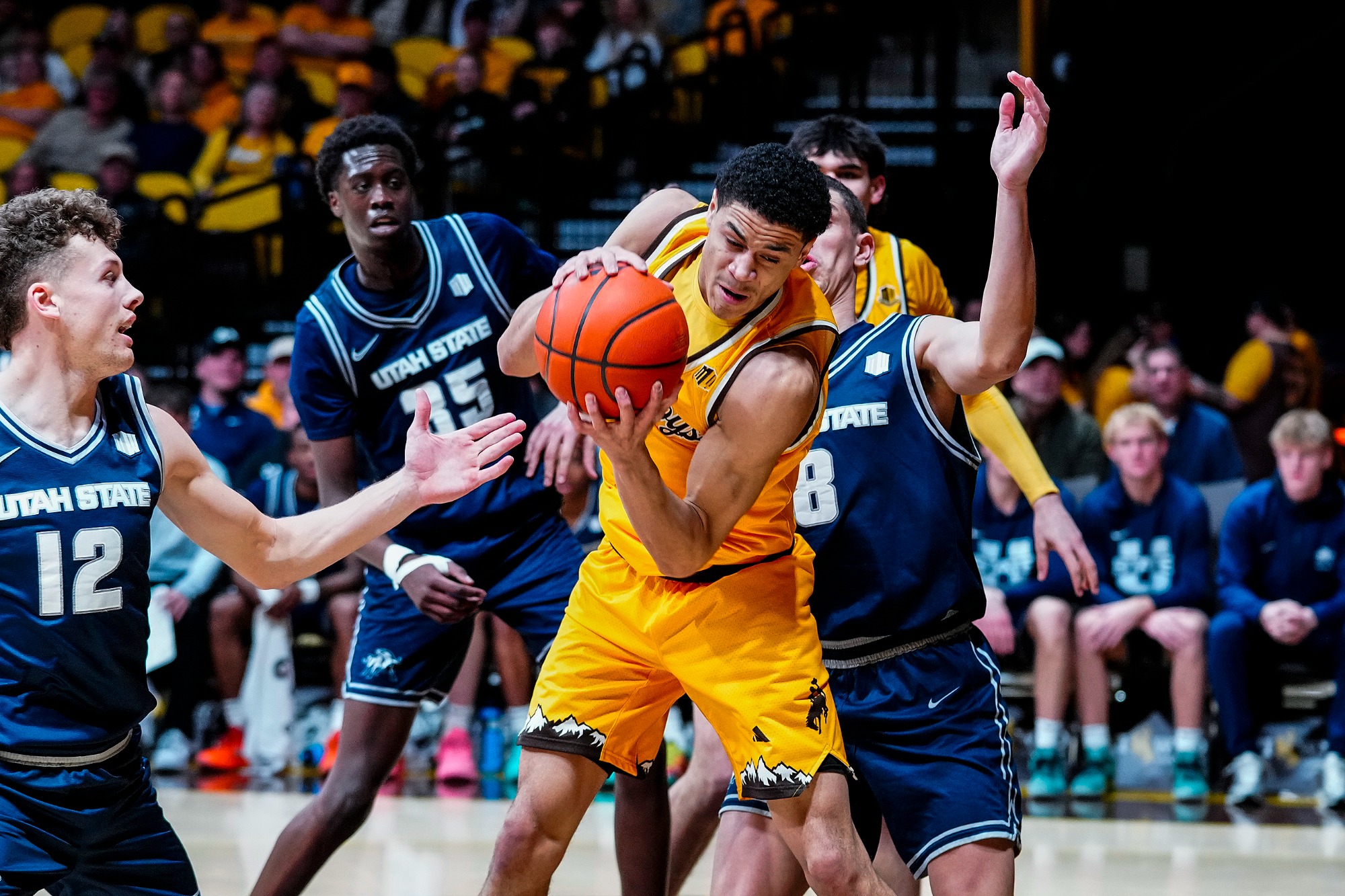 Feb 7, 2026; Laramie, WY, USA; Wyoming Cowboys guard Damarion Dennis (1) against the Utah State Aggies at Arena-Auditorium. Mandatory Credit: Troy Babbitt-UW Media-Athletics