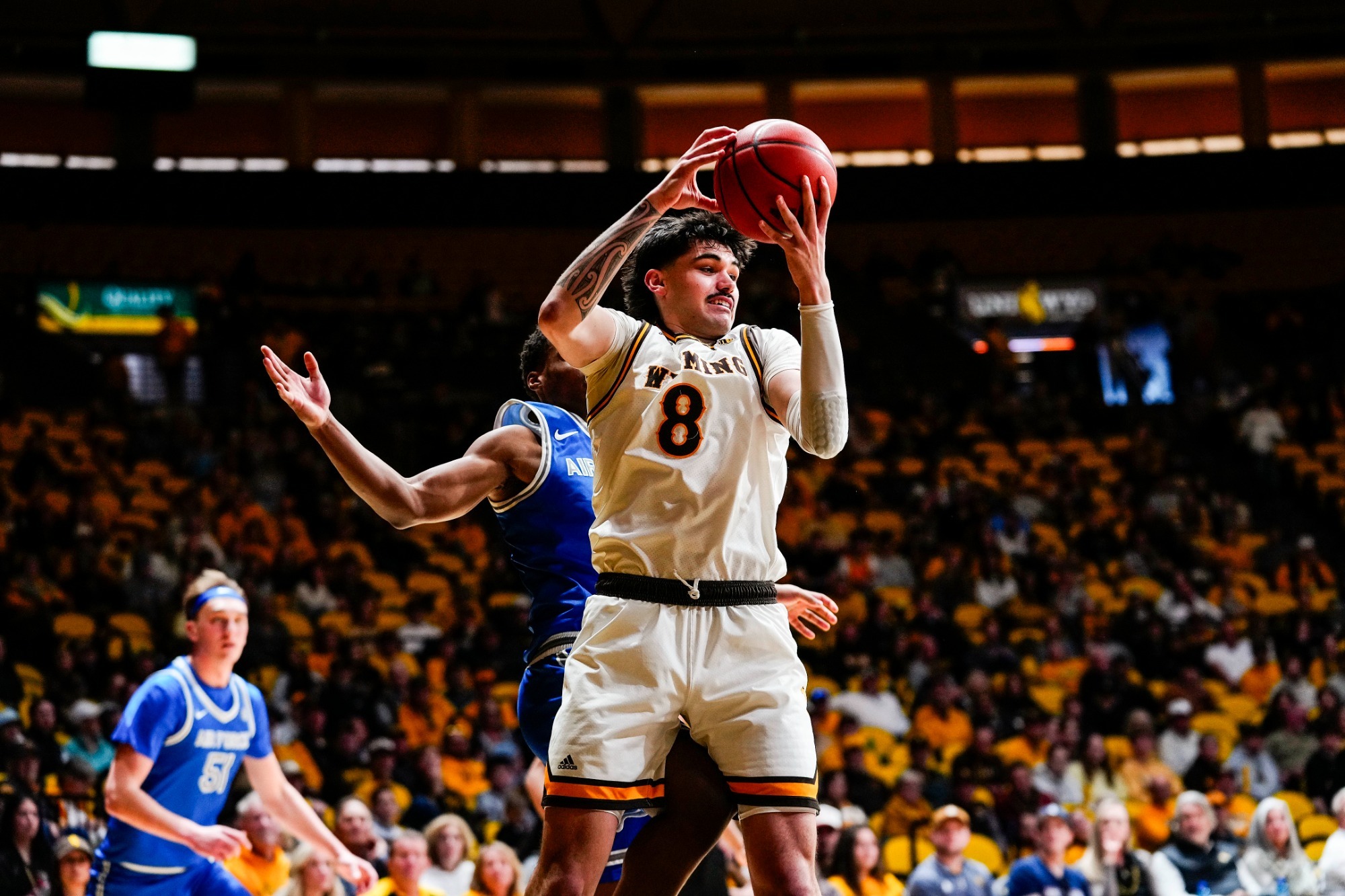 Kiani Saxon grabs a rebound against Air Force in 2026