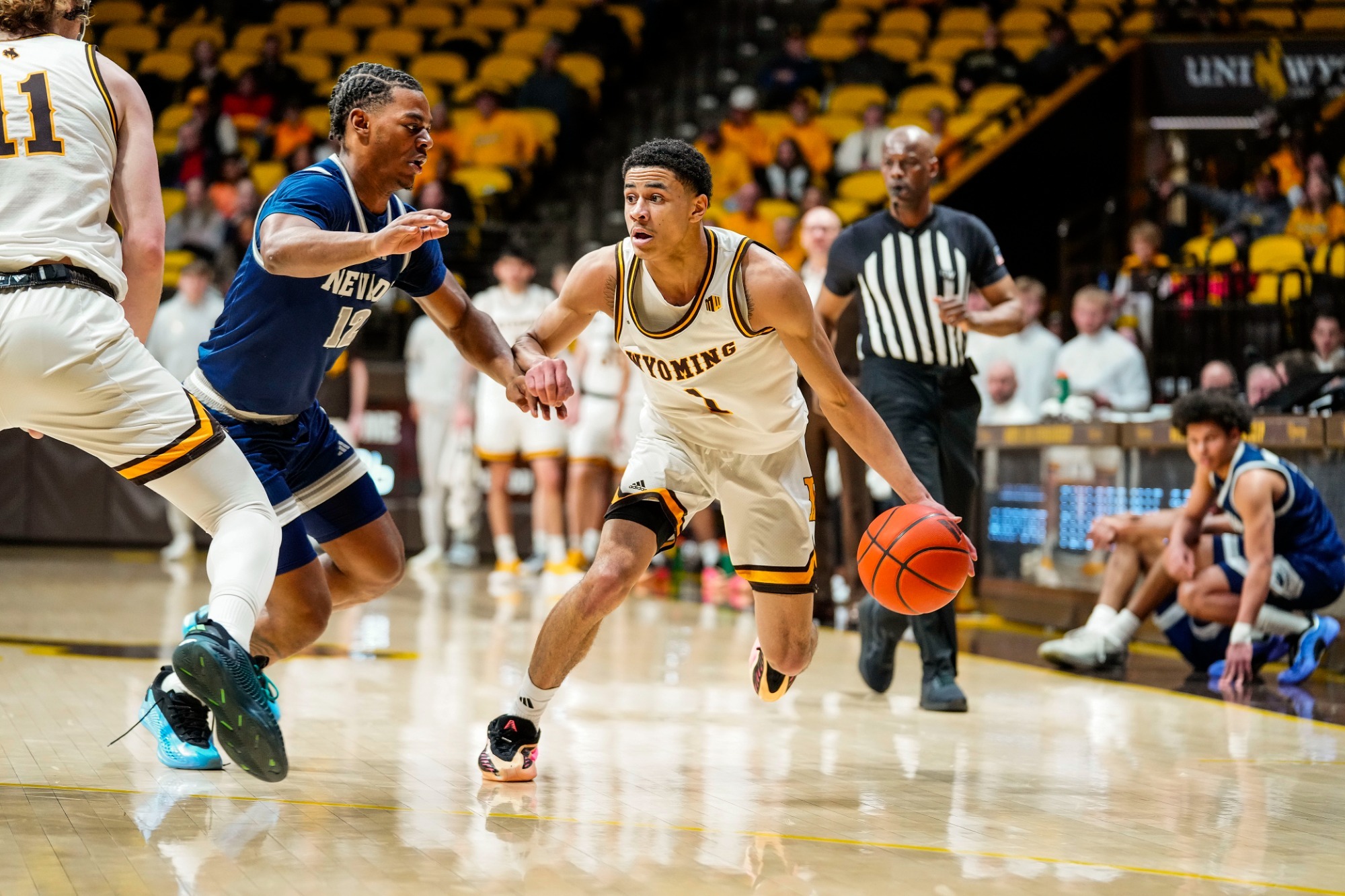 Mar 3, 2026; Laramie, WY, USA; Wyoming Cowboys guard Damarion Dennis (1) against the Nevada Wolf Pack at Arena-Auditorium. The Cowboys beat the Wolf Pack 83-73. Mandatory Credit: Troy Babbitt-UW Media-Athletics